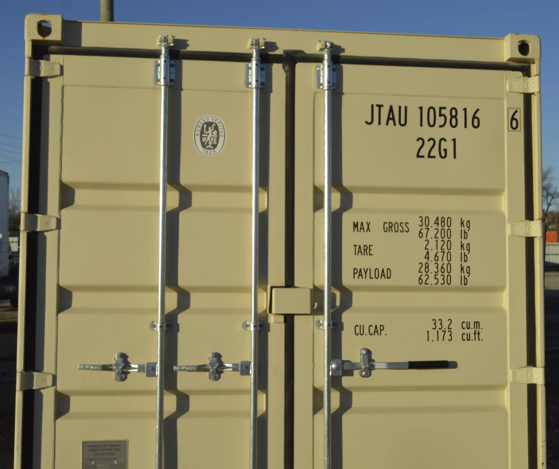 Close-up of double door locking mechanism on a one trip 20 ft steel storage container in Fort Worth, TX, showing durable hardware and solid construction.