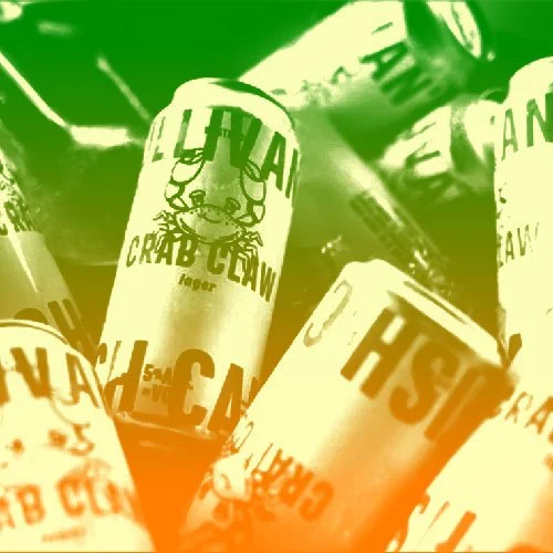 Several cans of Crab Chow, a crab snack, on a shelf with green overlay. Basic Projects