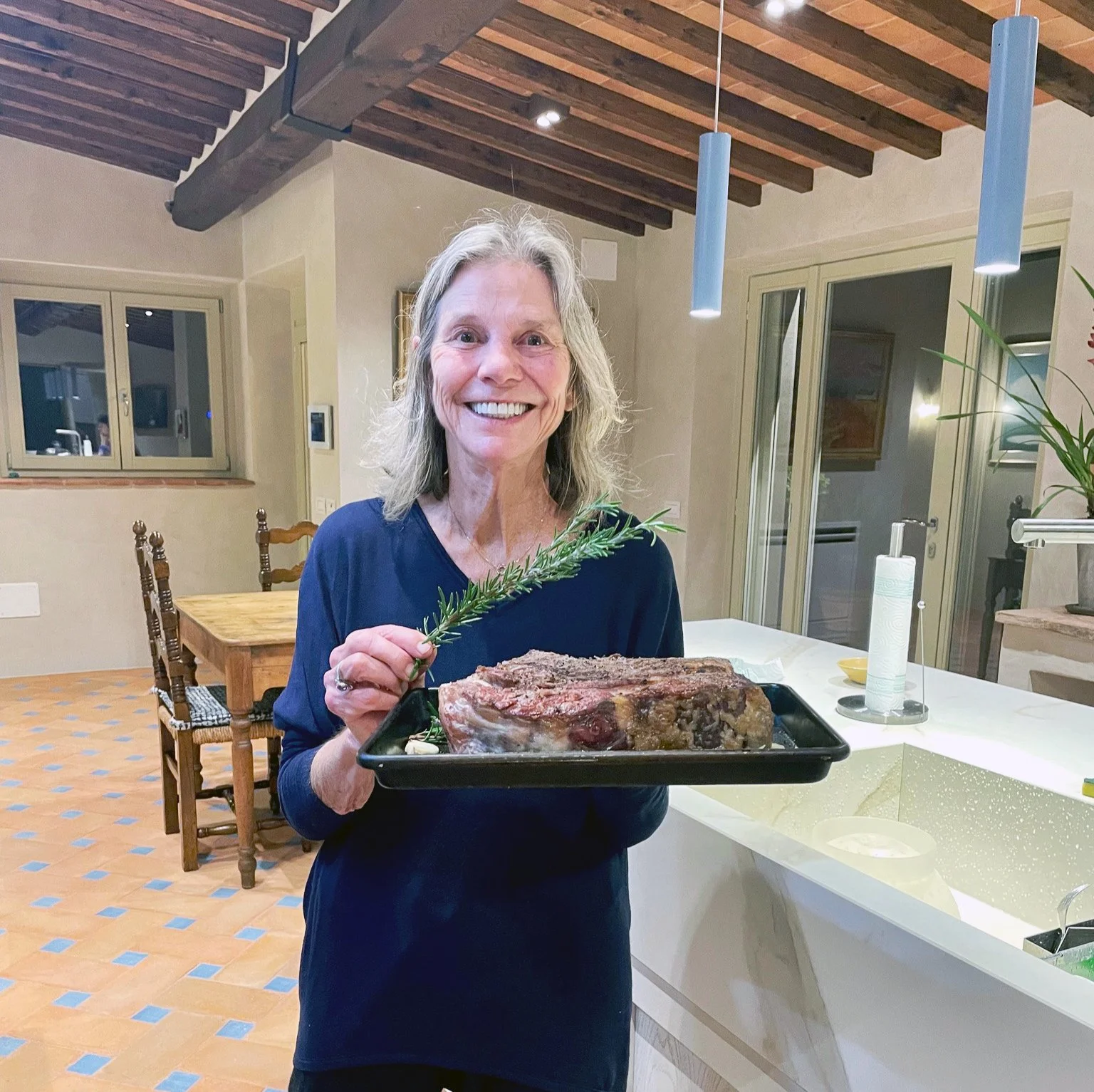 Sally Uhlmann preparing the grill the Bistecca alla Fiorentina
