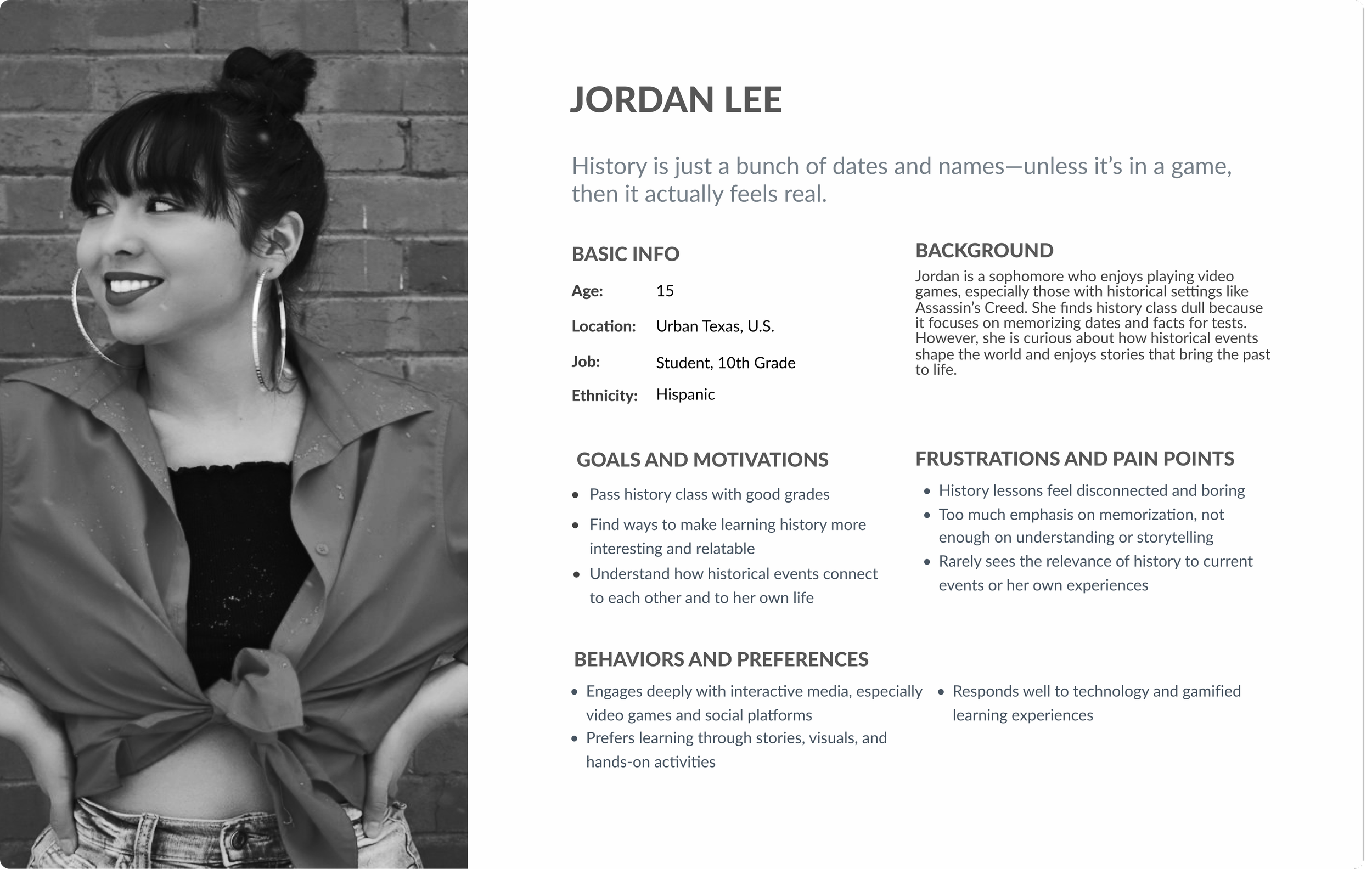 Young woman with dark hair in a bun wearing a jacket, hoop earrings, and smiling, standing in front of a brick wall.