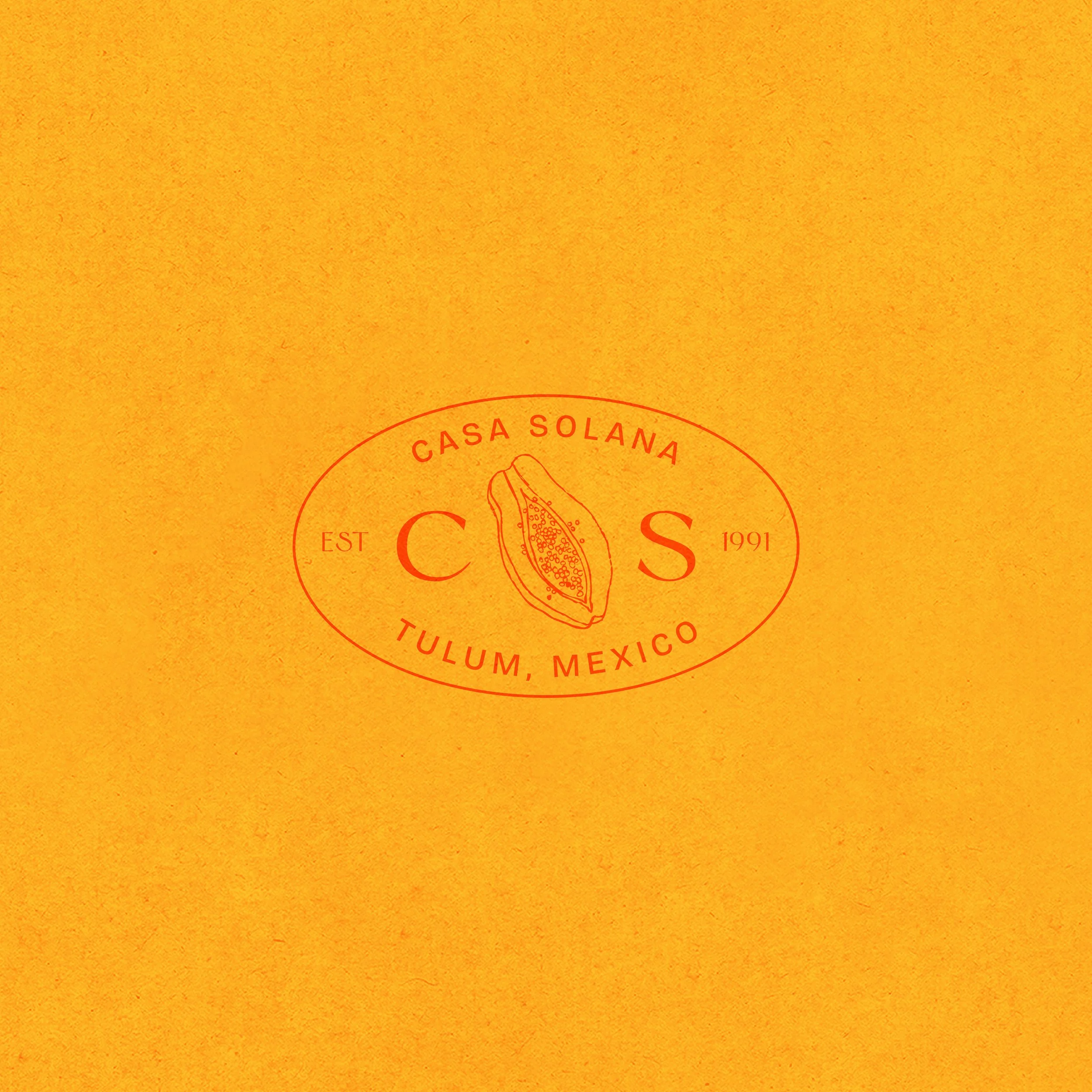 Casa Solana's Emblem showcased on a golden yellow background.