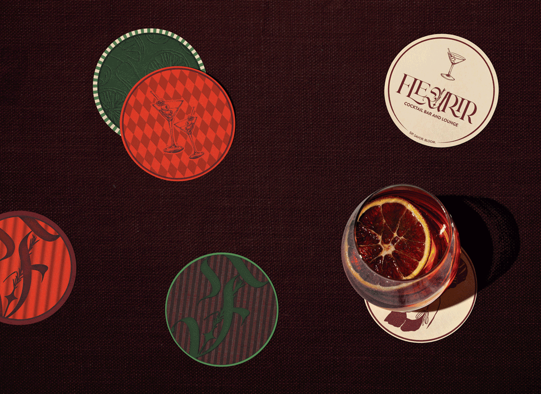 A cocktail bar scene with drink coasters featuring illustrations, and a glass of red-colored drink with a slice of blood orange on top, placed on a round coaster with a bar's logo.