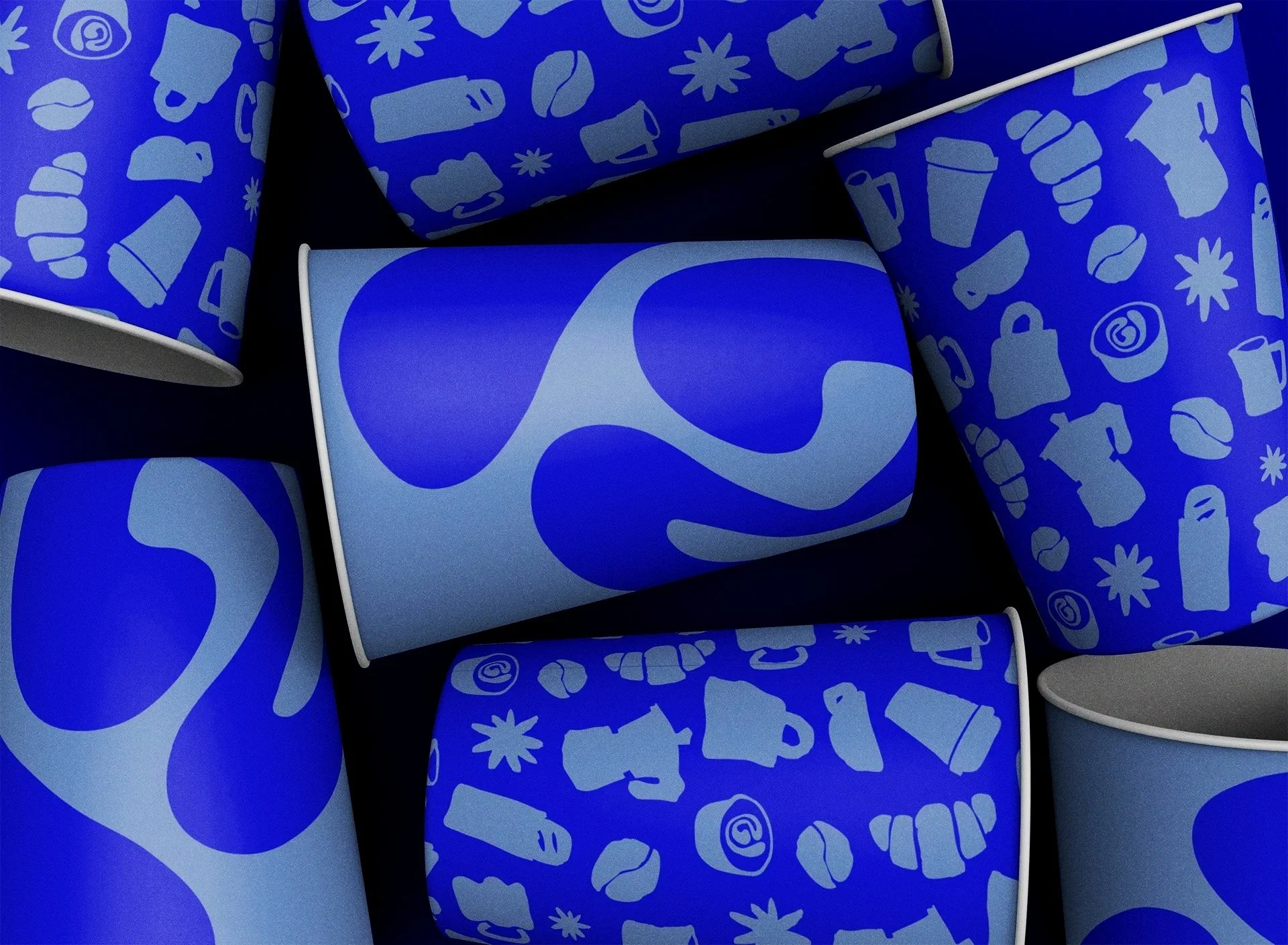 Several blue paper cups with matching designs, some with large abstract blue shapes, some with a pattern of various office-related icons in light blue, on a black background.