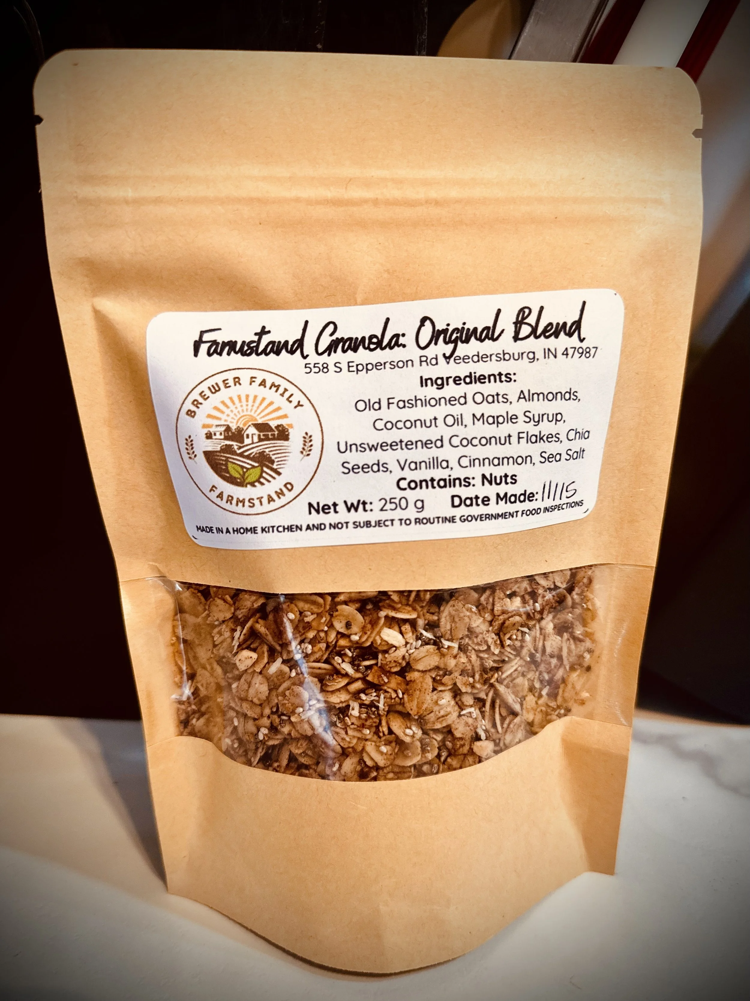 A labeled package of Farmstand homemade granola showing the granola inside.