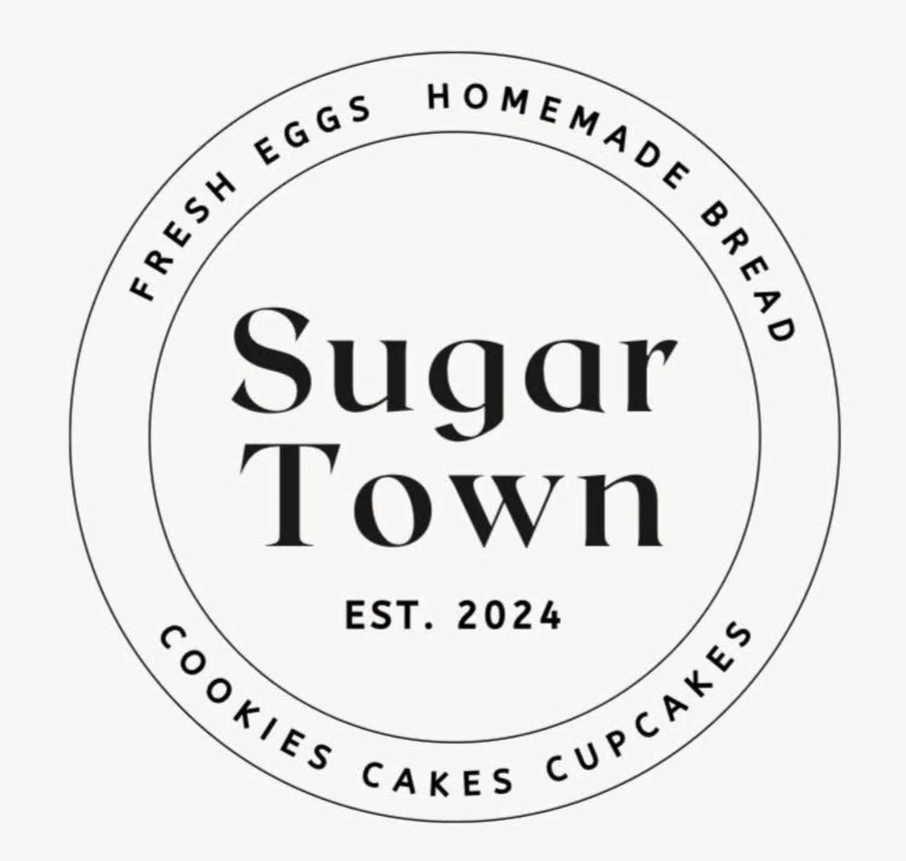 Sugar Town logo, a bakery based in Covington, Indiana offering homemade baked goods including cookies, cakes, and cupcakes.