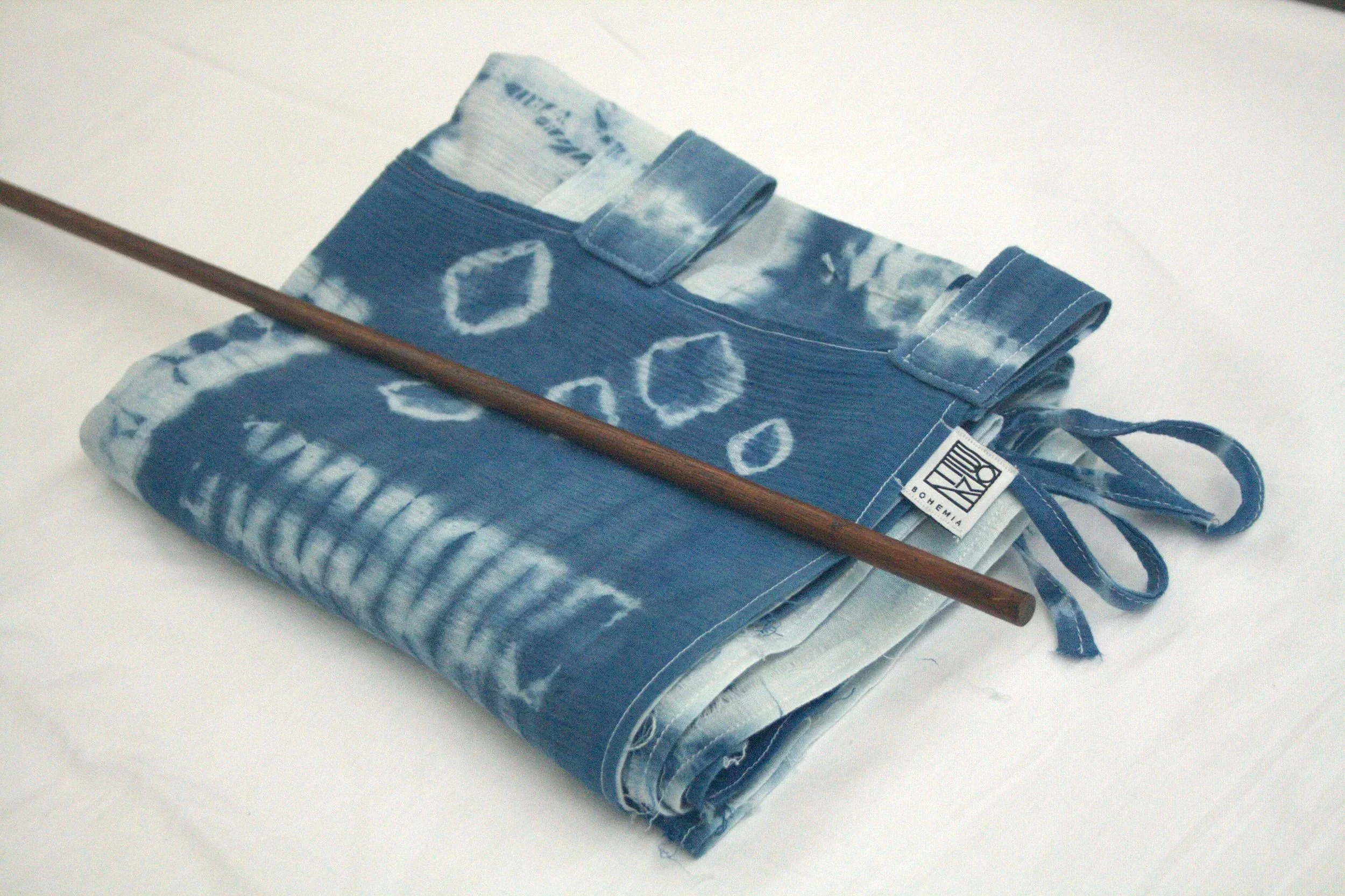 shibori+noren+folded+with+dowl.jpg