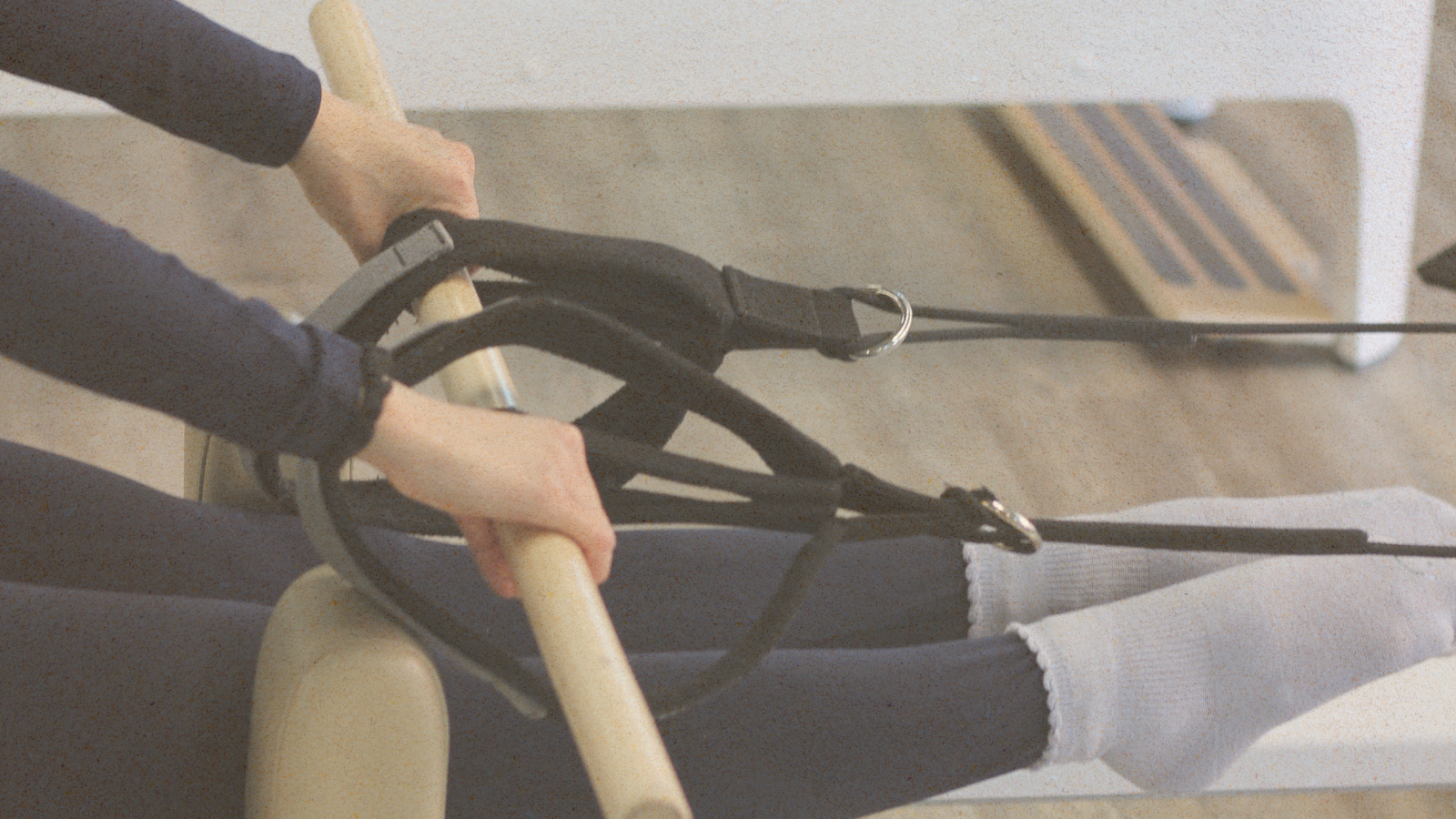 Woman on a pilates reformer machine