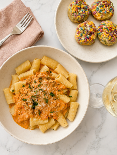 pasta palte with vodka cream and rigatoni and cookies.png