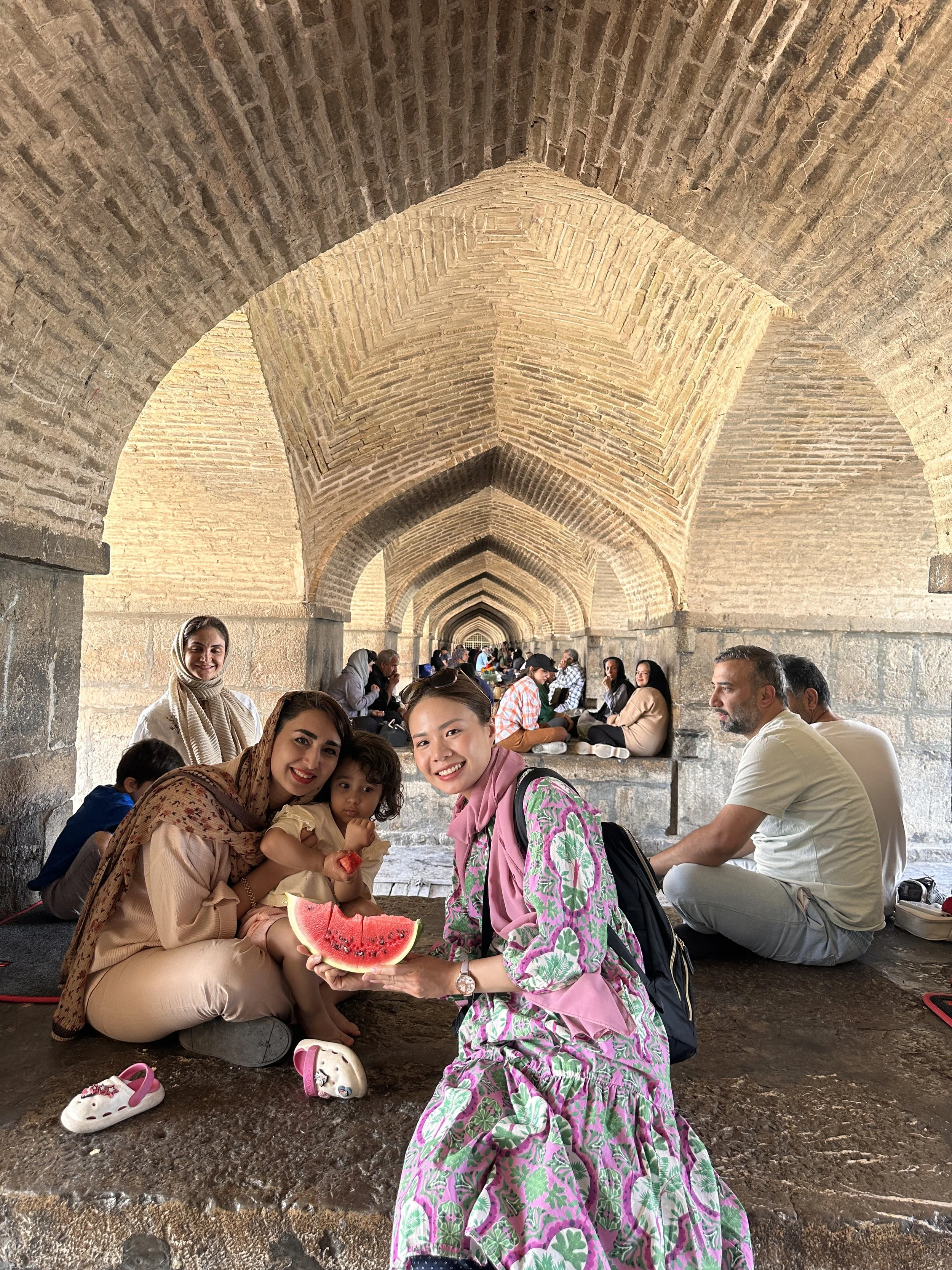 Walking beneath the iconic 33-arch Safavid bridge on a Sunday afternoon, a sweet local family kindly offered me watermelon