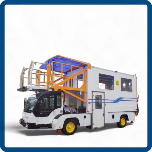 A white mobile medical or transportation vehicle with yellow wheels, featuring a blue and yellow lift or platform on top, against a plain background.