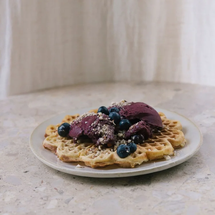 Whole-grain waffles topped with açaí sorbet