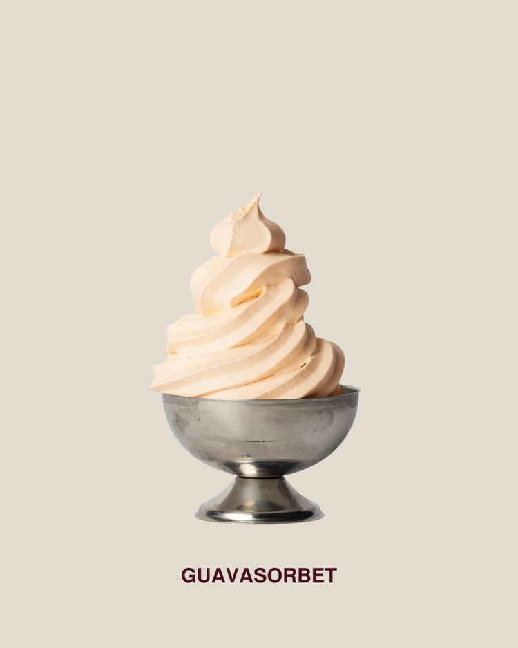 Guava sorbet served as soft-serve in a silver bowl