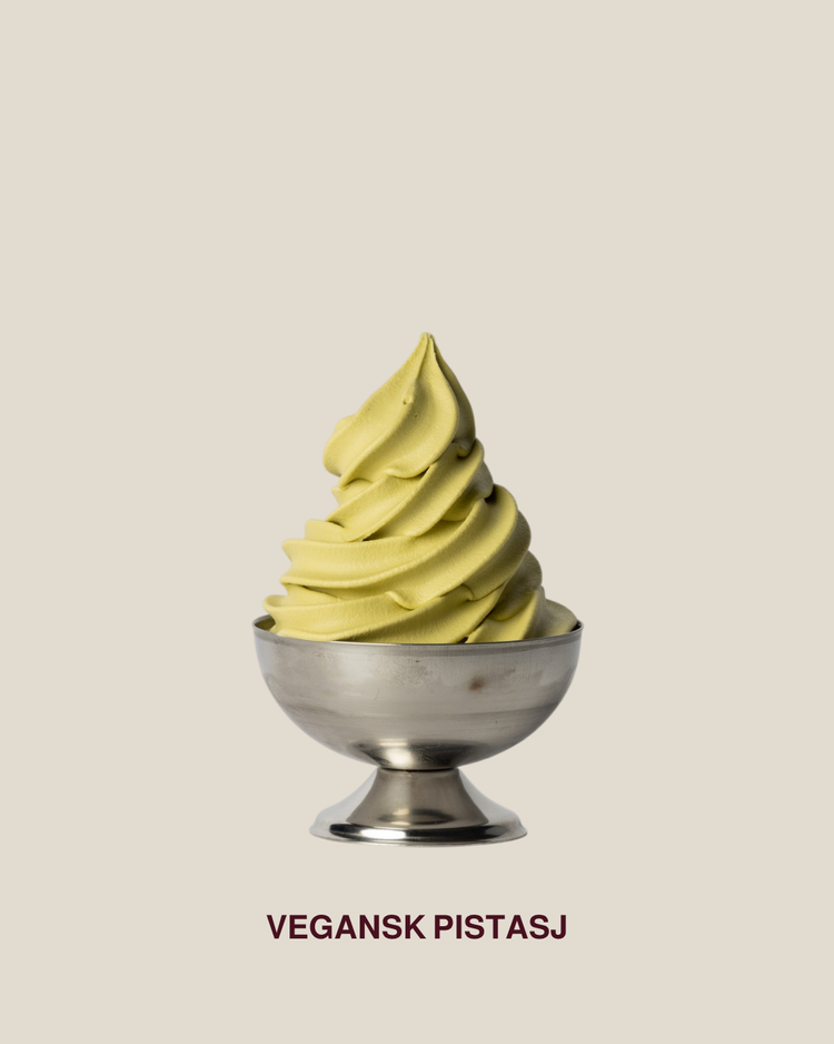 Vegan pistachio soft-serve served in a silver bowl