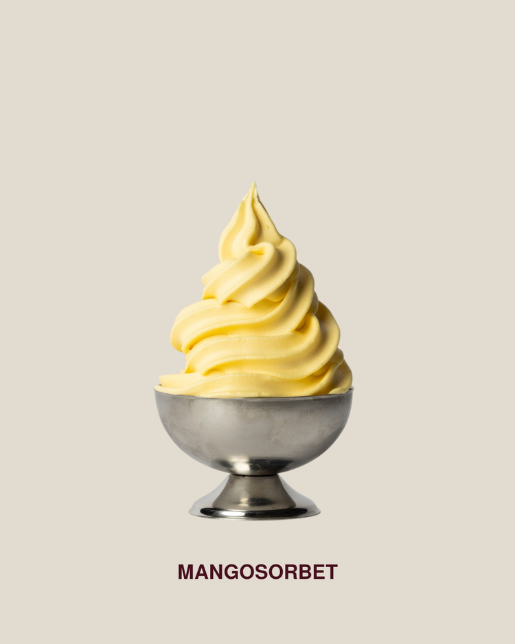 Mango sorbet served as soft-serve in a silver bowl
