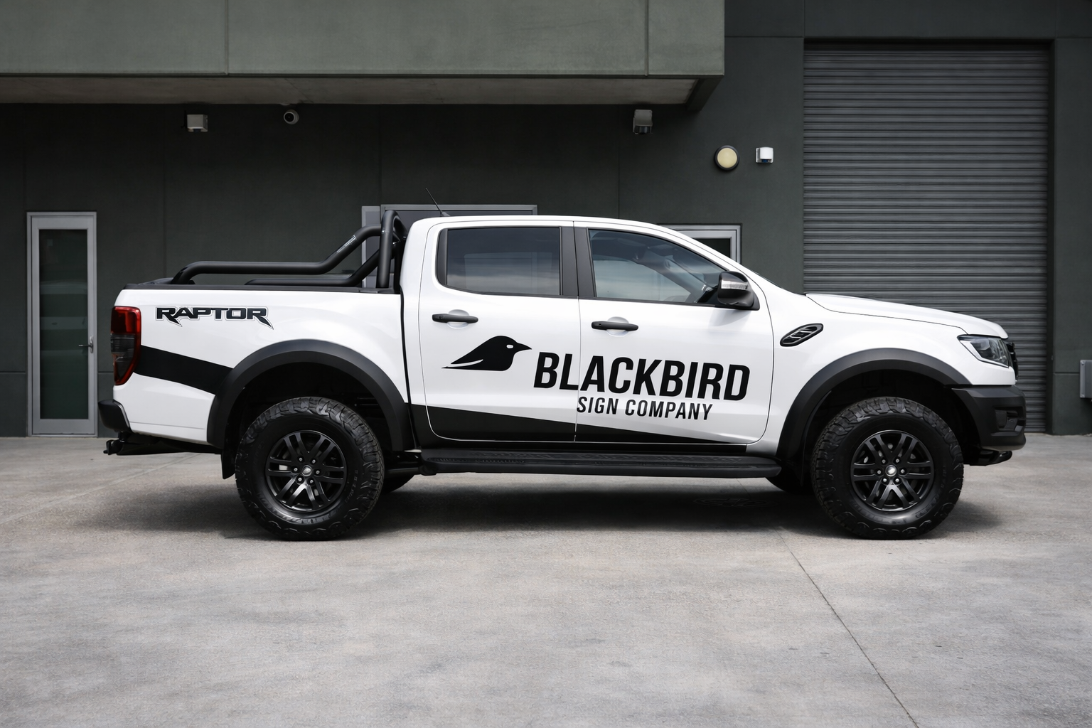 Custom vehicle decals on a white Ford Ranger, professionally designed and installed by Blackbird Sign Company