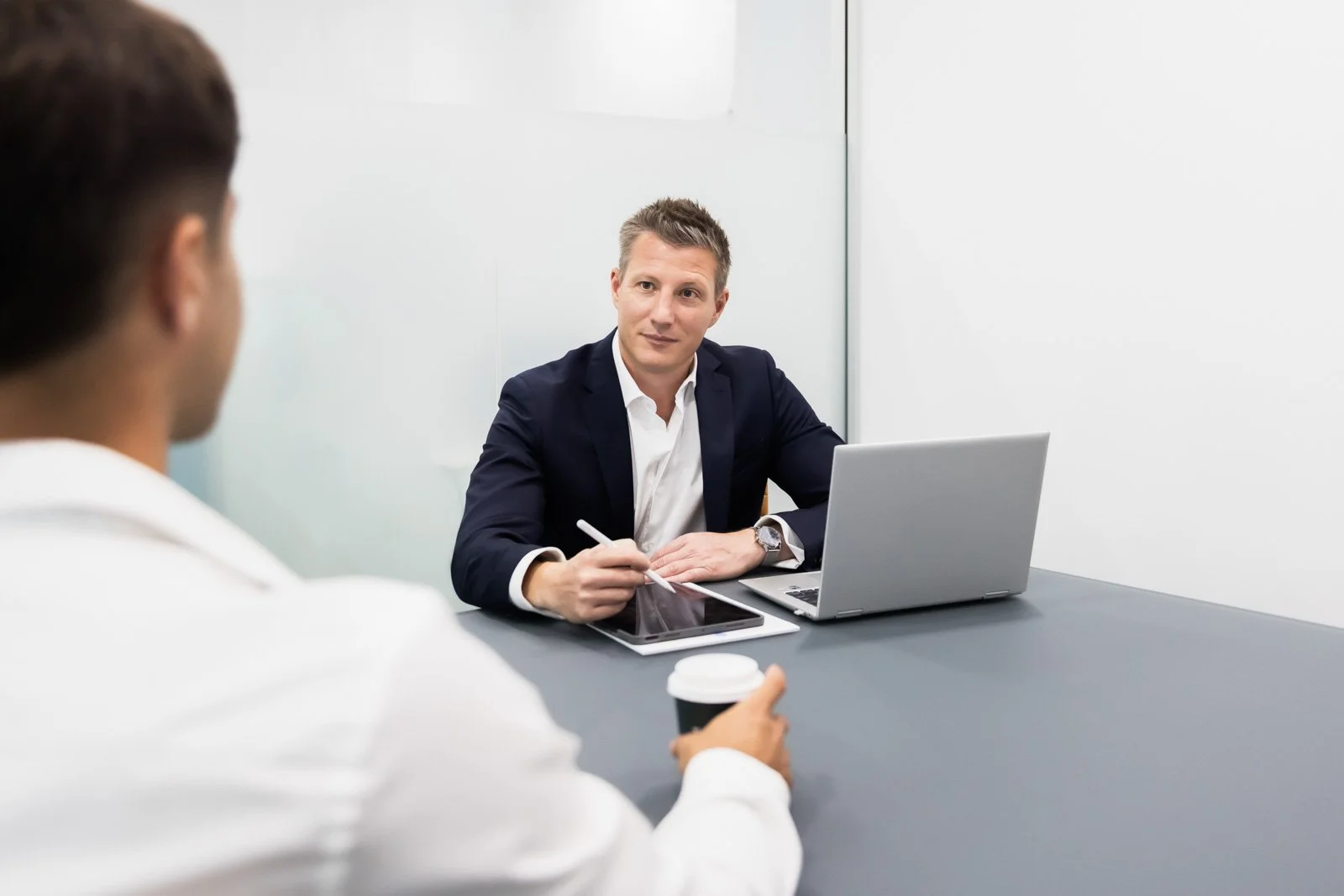 Queensland Capital Solutions managing director discussing a residential loan application with a client.