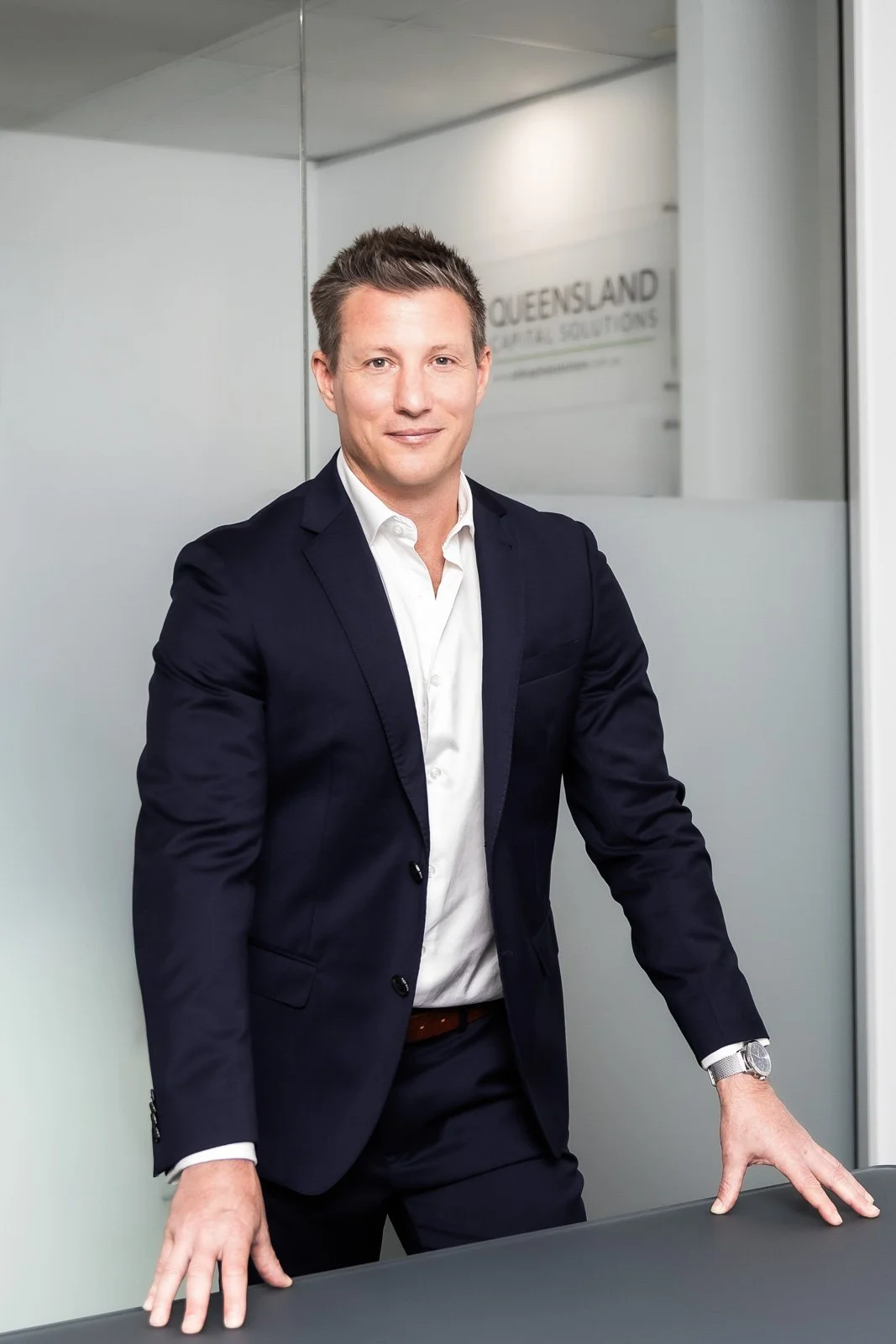 Adrian Mula, Director of Queensland Capital Solutions, standing in the Sunshine Coast office.