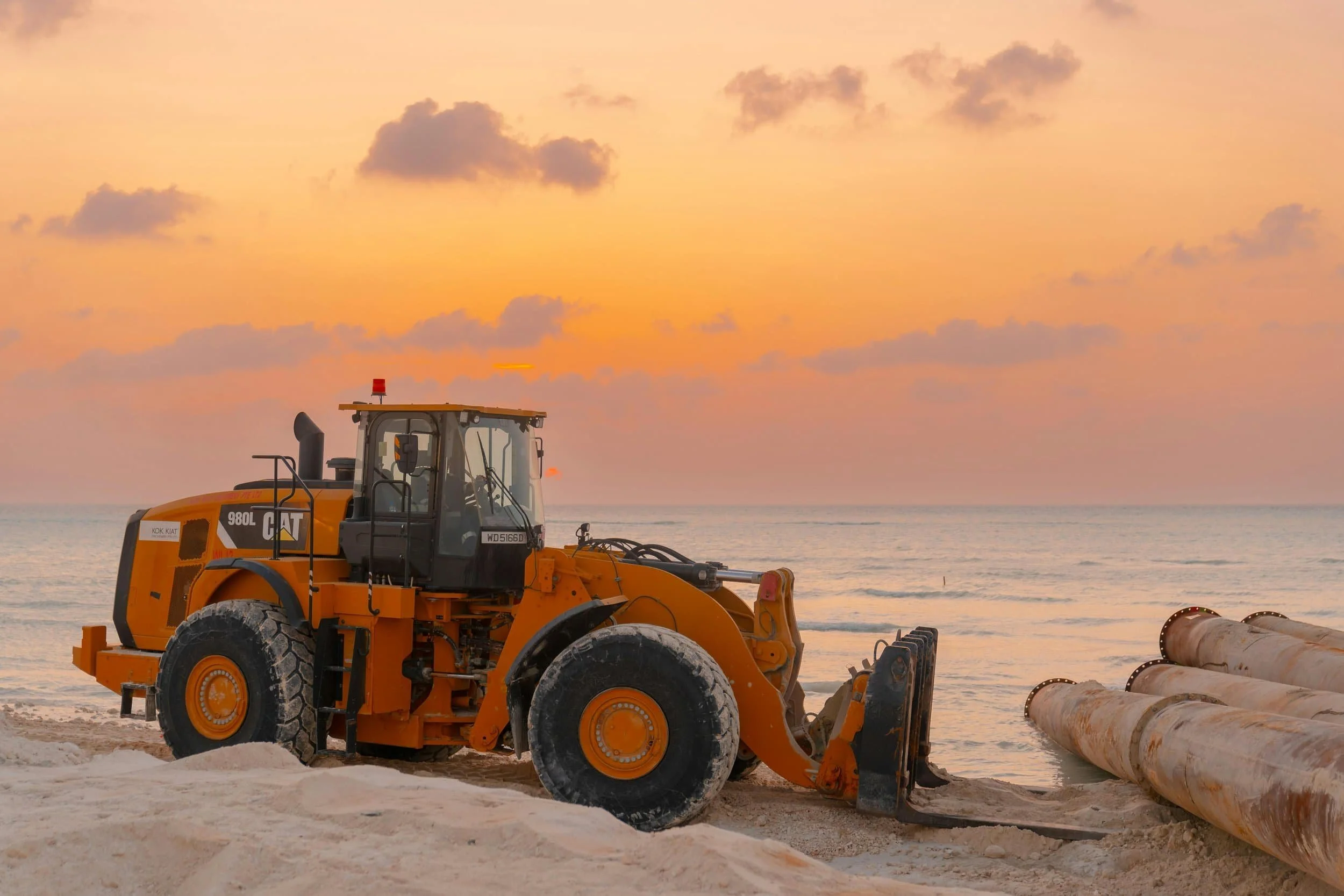 Heavy orange earthmoving machinery representing business equipment and asset finance.