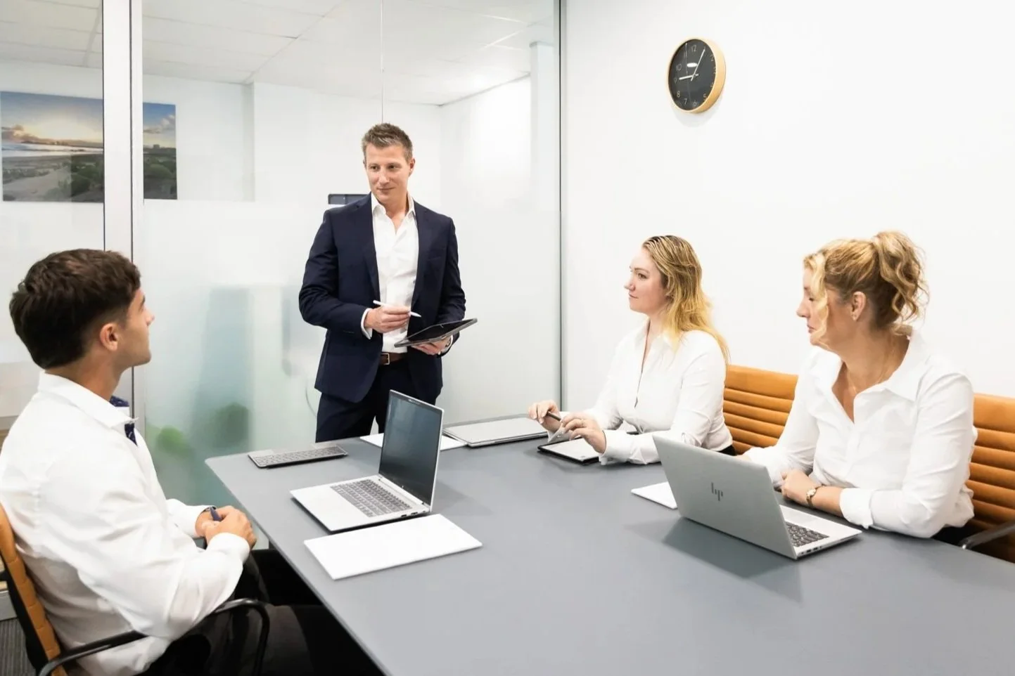 QCS commercial brokers in a boardroom meeting