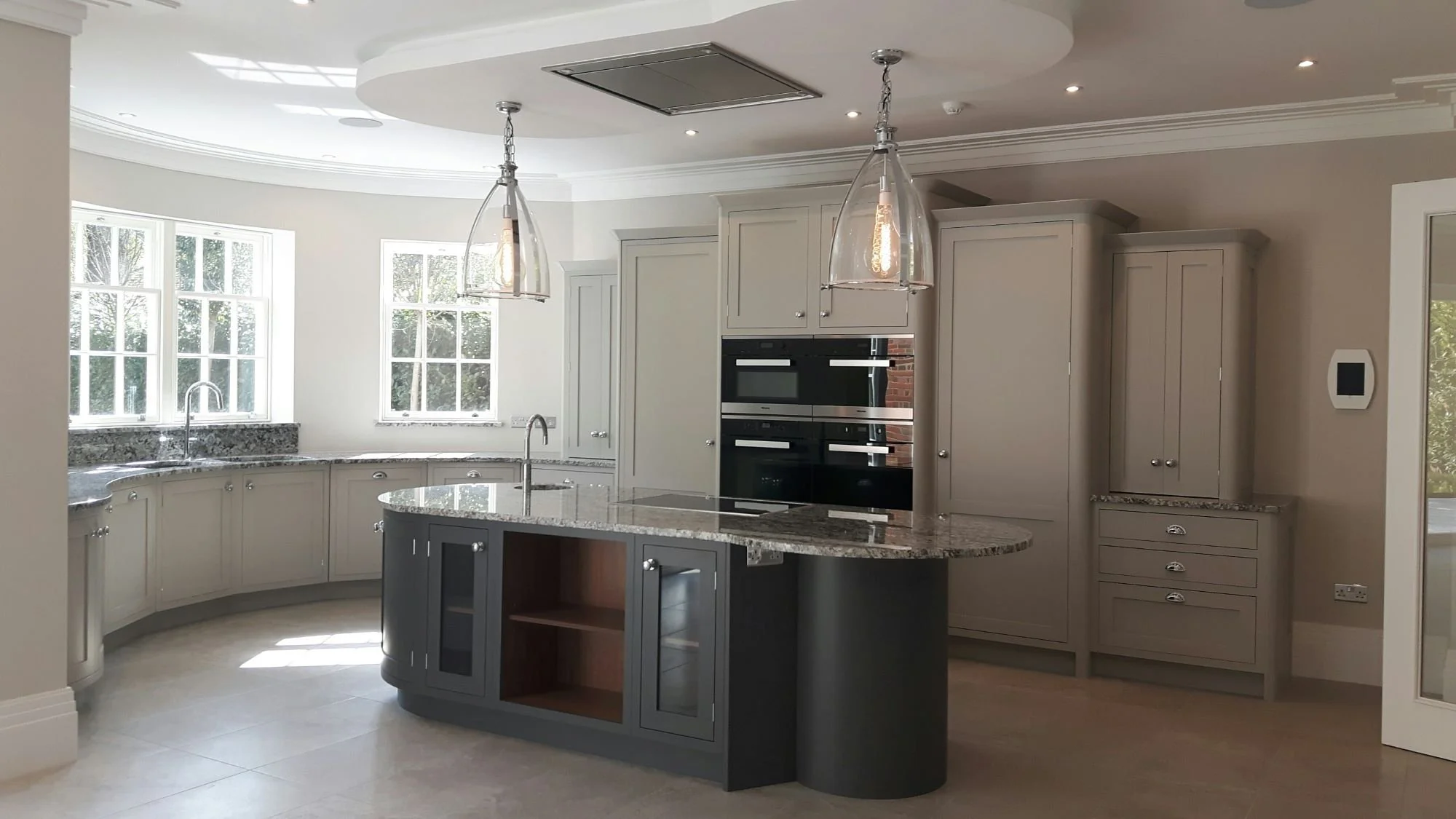 Azul Aran Granite Curved Kitchen.jpg