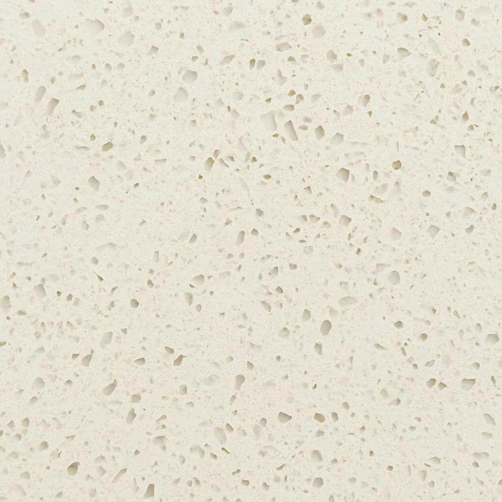 Close-up image of a white, porous, sponge-like material, possibly foam or styrofoam.
