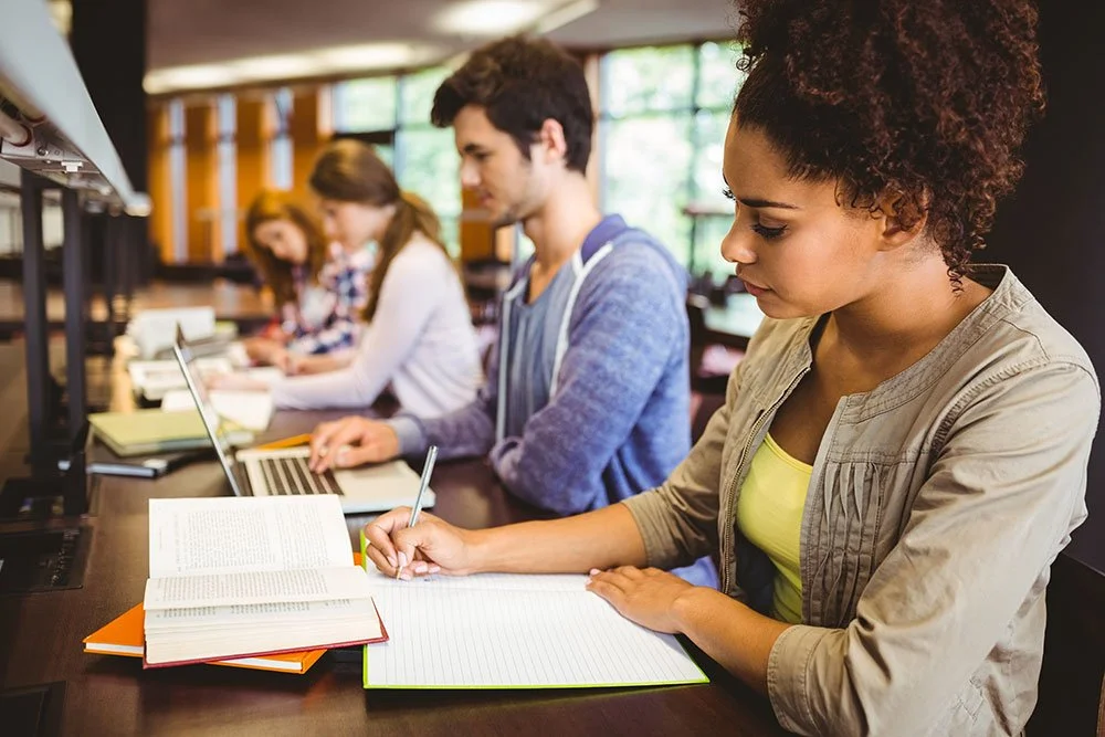 Students sitting in a row at desks