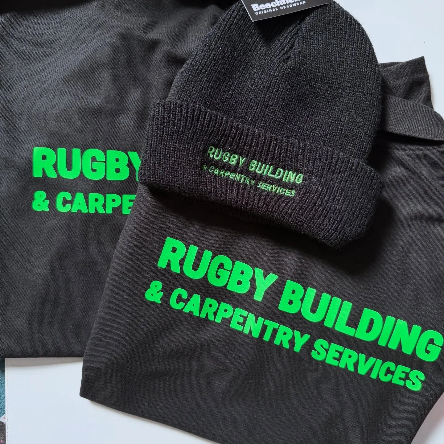 Full package for Rugby Building and Carpentry Services- Beanies, Rtx Tees, polos, sweats and Hoodies. A mixture of print &amp; embroidery.