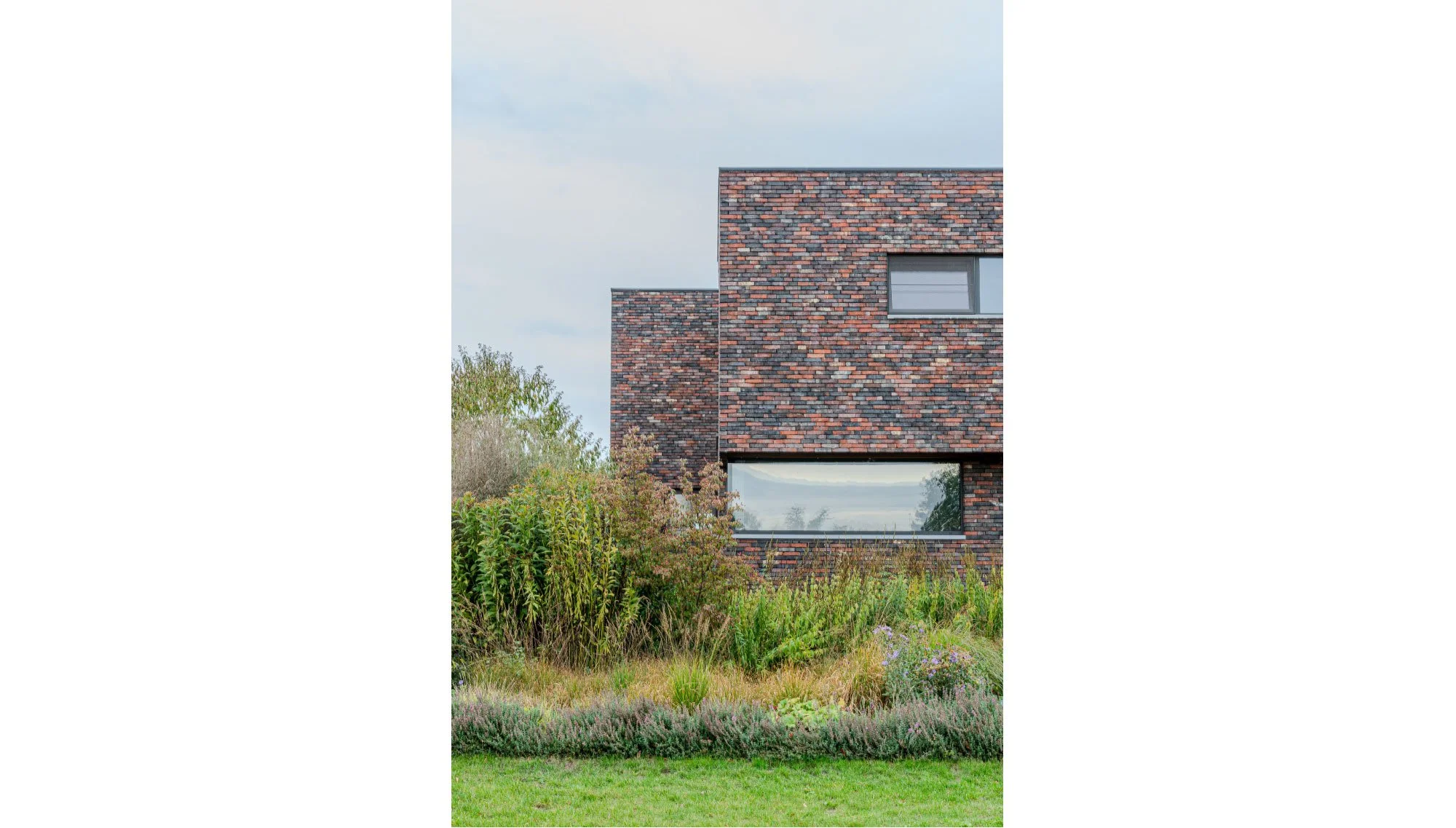 Gevel moderne nieuwbouwwoning, plan getekend door Gert Anthonissen Architect. Architectenbureau regio Noord Antwerpen.