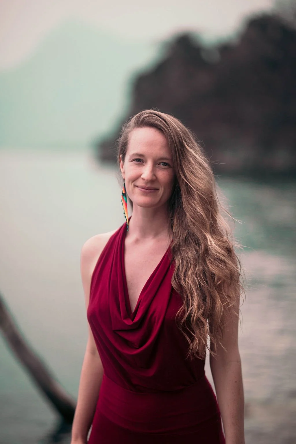 Gaia, Evolutionary Astrologer and teacher, portrait by the water for the Evolutionary Astrology Academy About page.