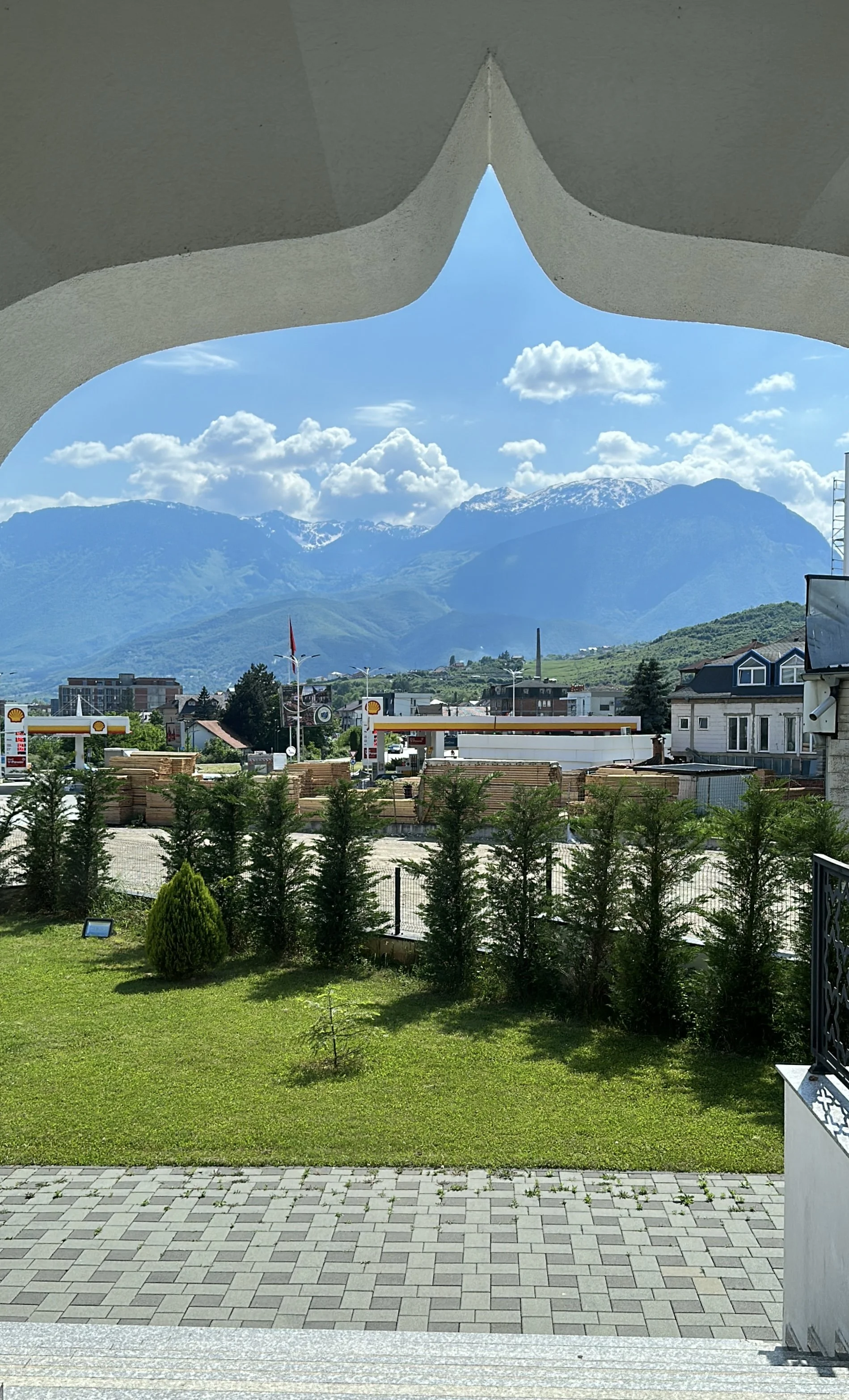 Mosque with a view of the mountains in Peja, Kosova