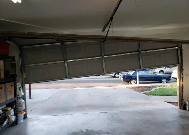 Garage Door stuck open out of track