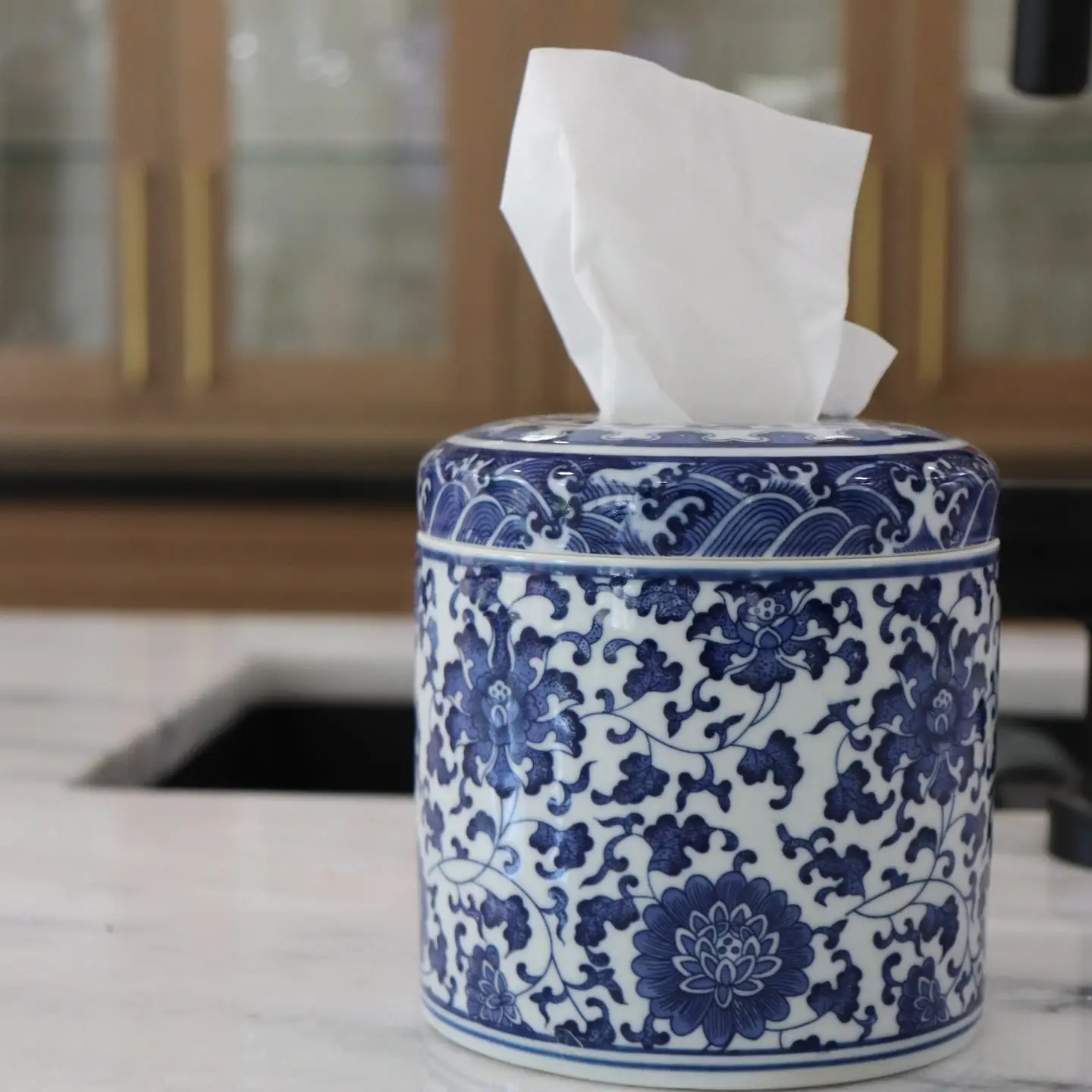 blue and white decorative tissue holder.png