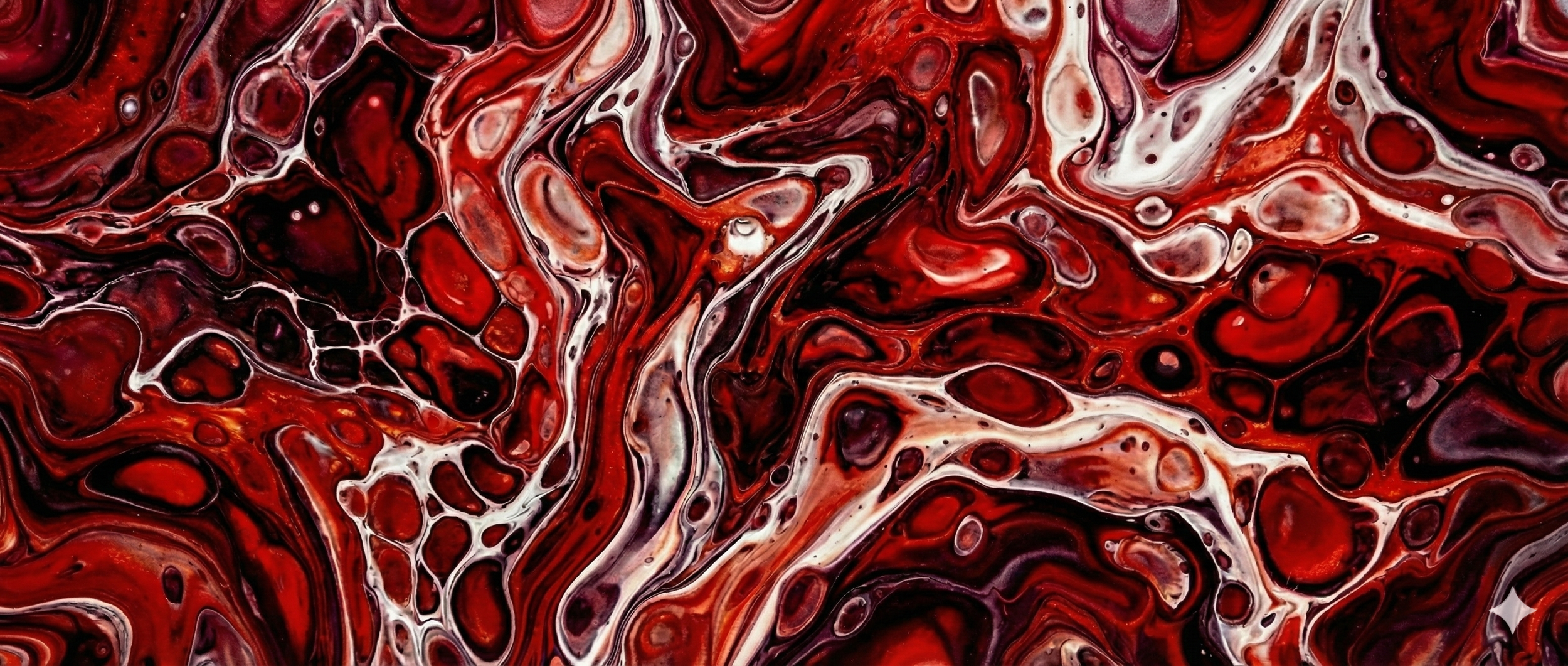 Red, black, and white abstract marbled pattern with swirling colors and cell-like structures.