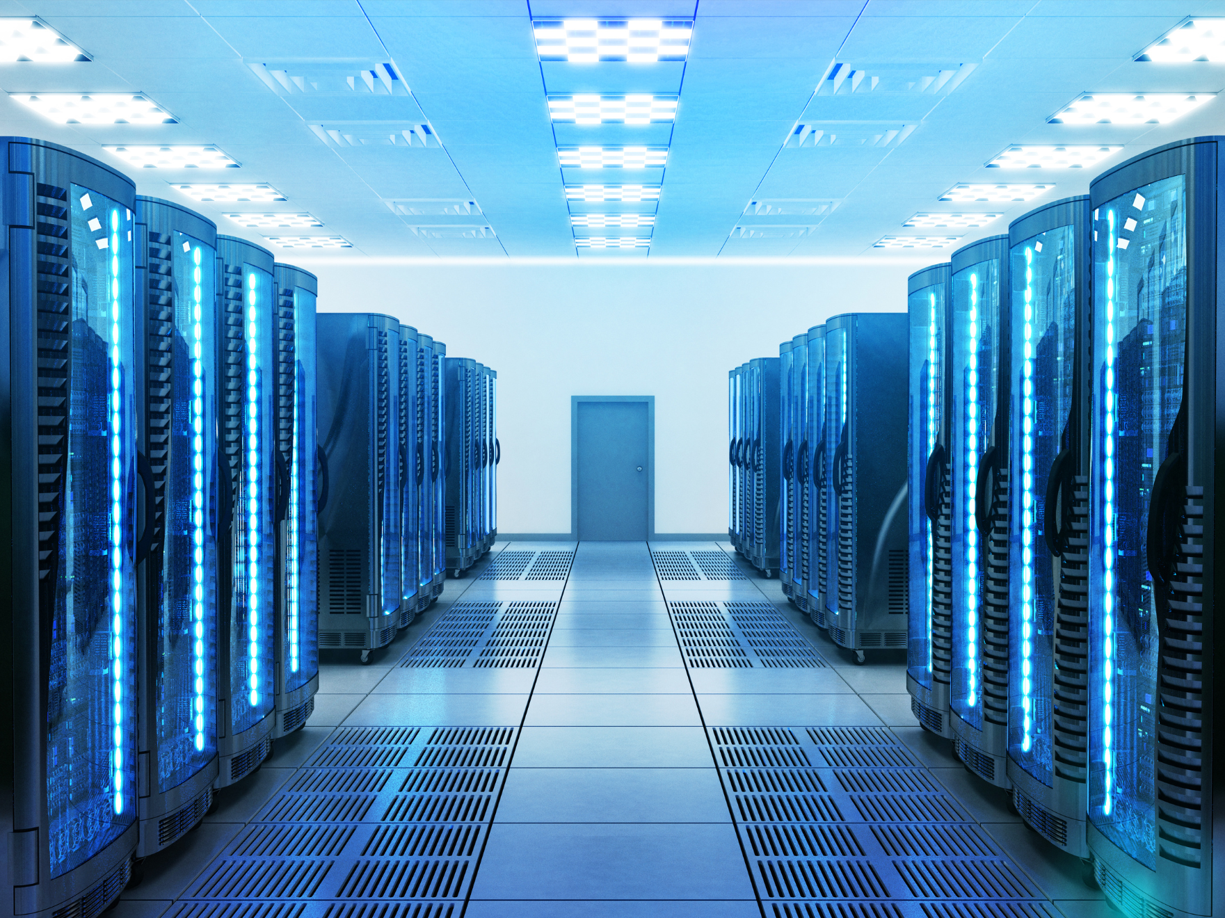 A data center room with server racks lined along both sides, illuminated by blue LED lights, with a closed door at the back and ceiling lights overhead.