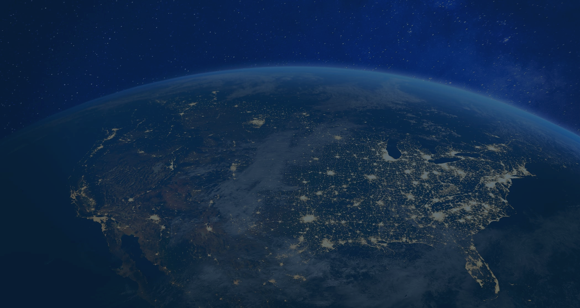 Earth viewed from space at night, with illuminated city lights visible in North America.