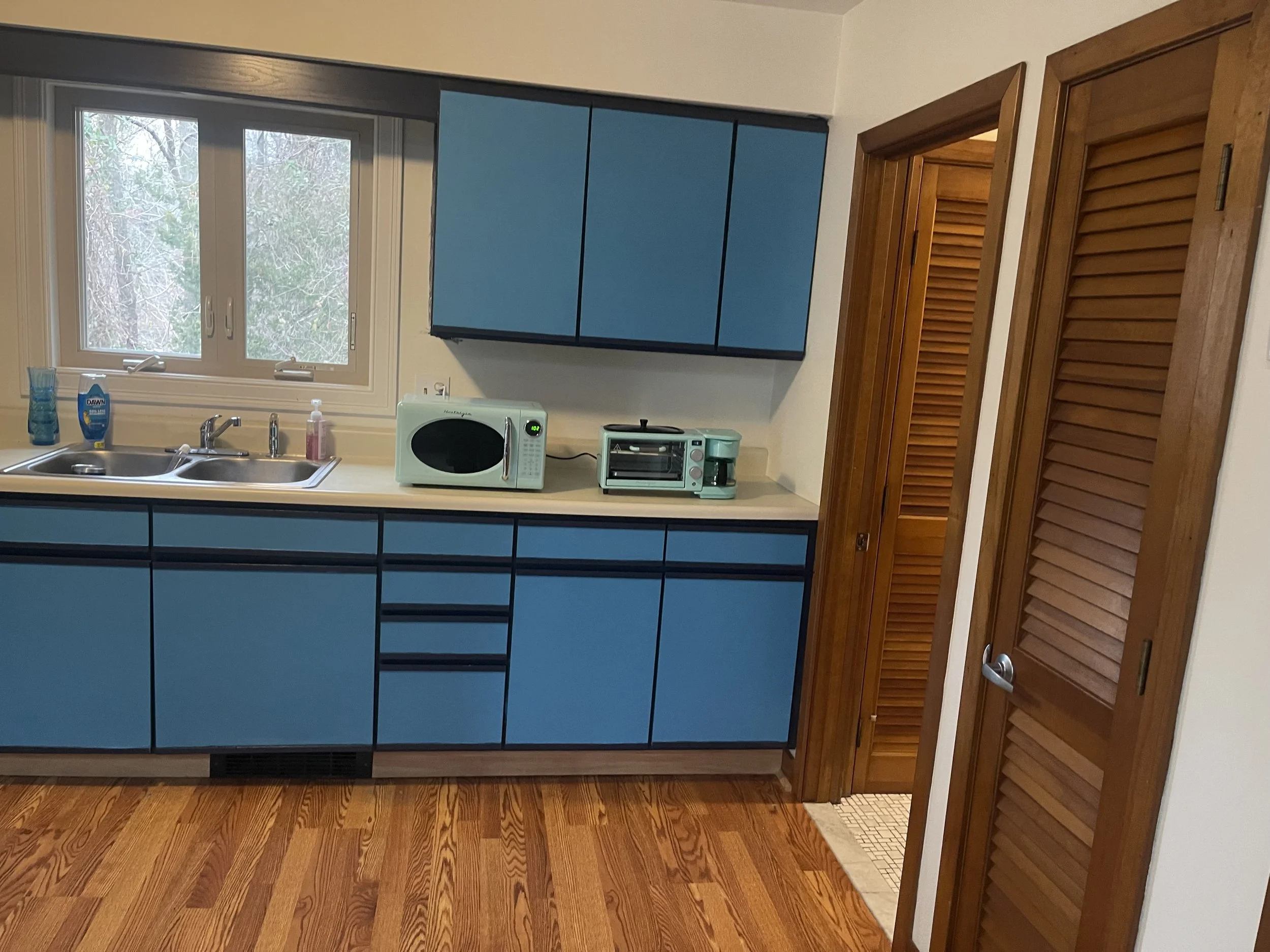 Full kitchen with coffee pot and microwave