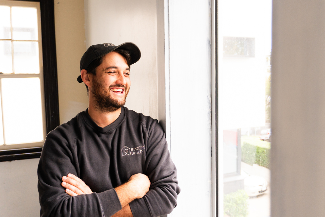 A man wearing Bloom Build work clothes