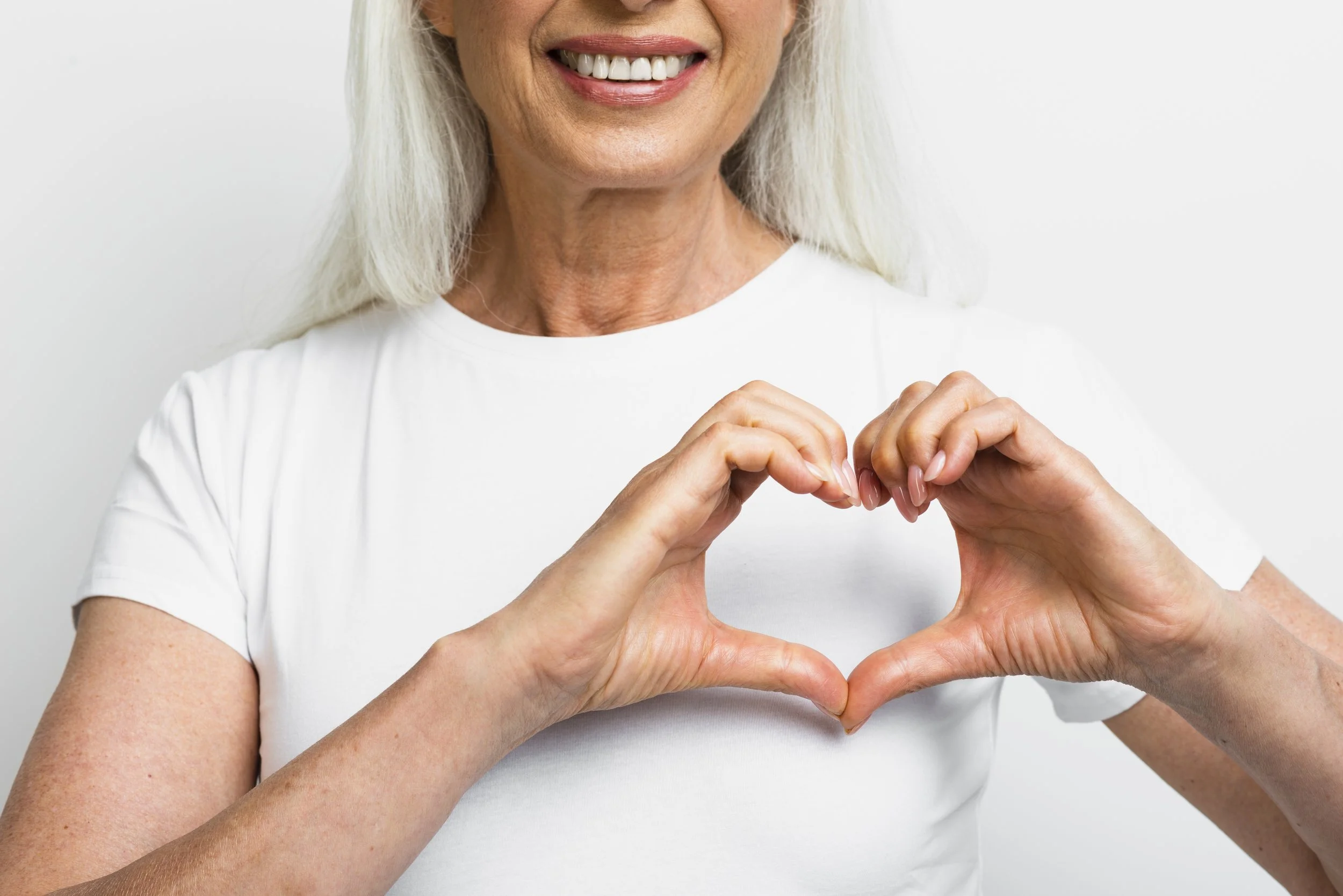 smiley-woman-showing-heart-with-hands.jpg