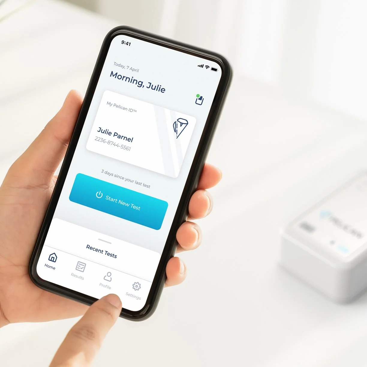 Hands holding a mobile phone displaying app dashboard