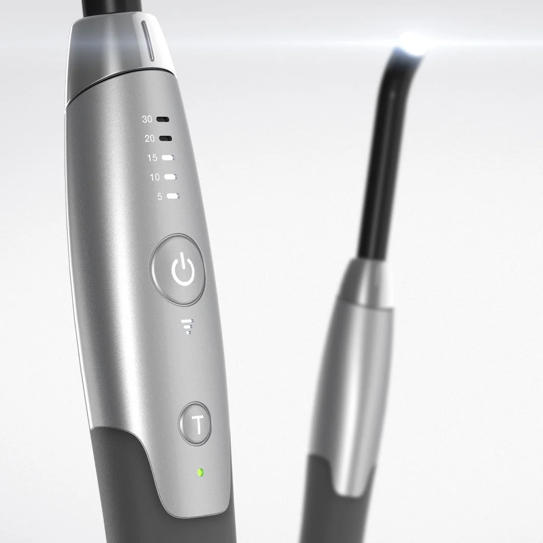 Closeup of a pair of UV curing dental tools