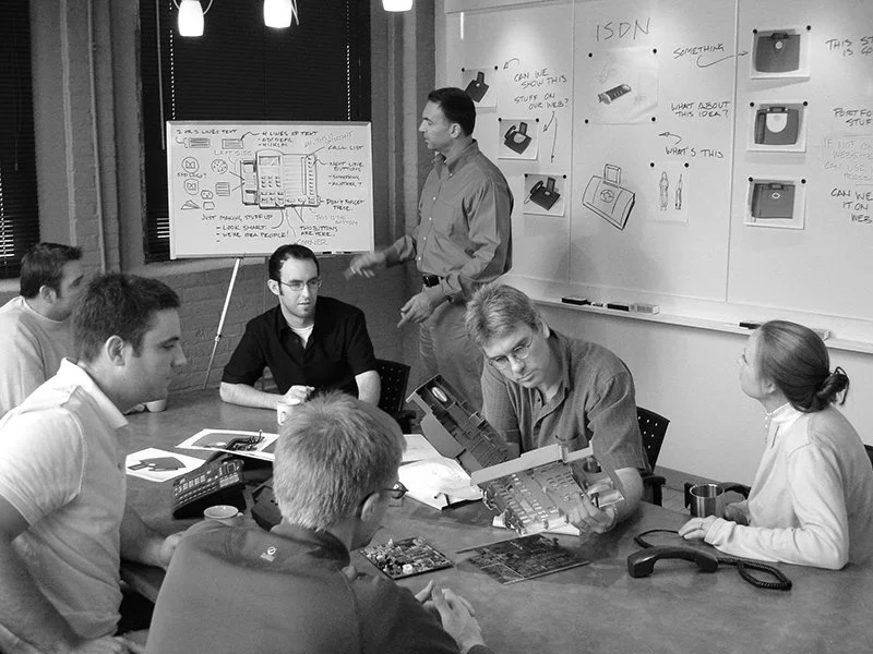 Historical photo of an industrial design team in the late nineties