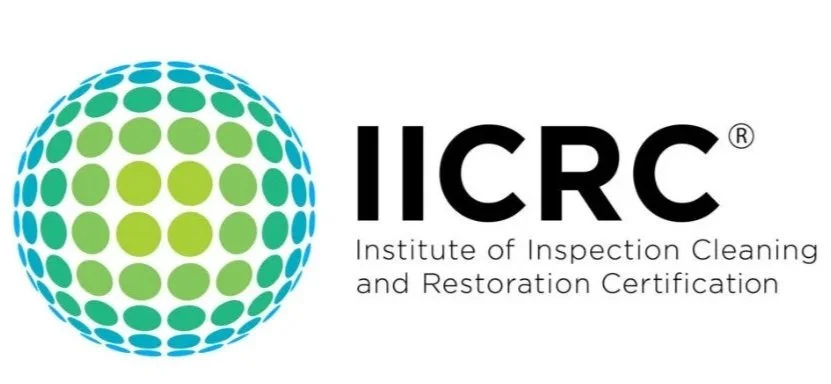 Logo for the Institute of Inspection Cleaning and Restoration Certification (IICRC), featuring a spherical design made of green and blue circles and the organization name.
