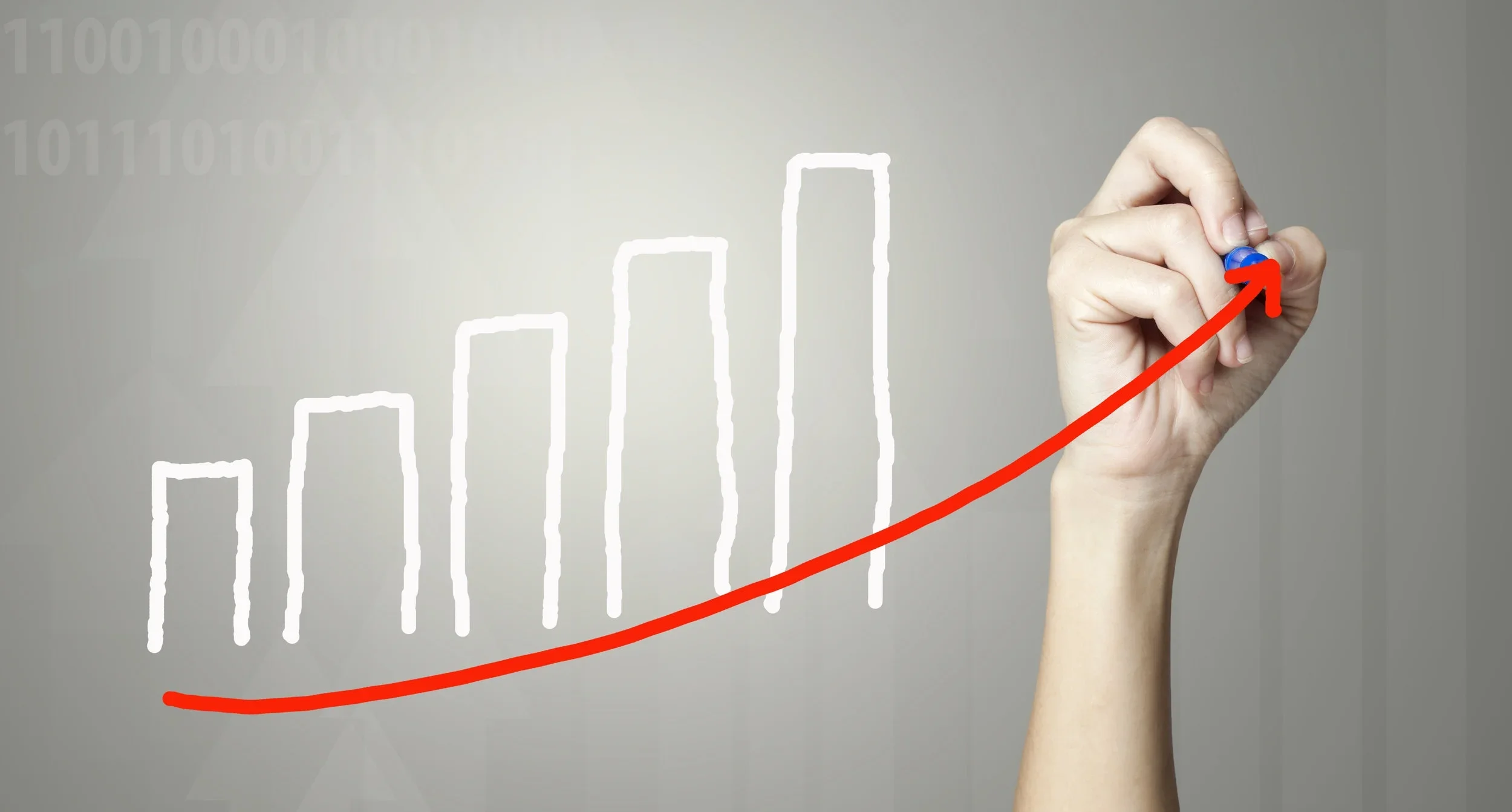Hand drawing a rising line graph with a red arrow.