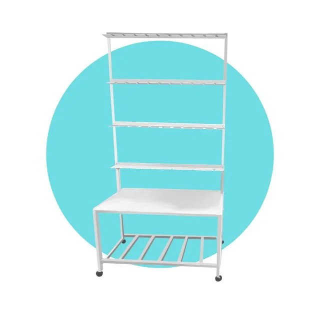 A champagne or cocktail serving wall on wheels with four tiers and a flat surface at the bottom, set against a blue circular background.