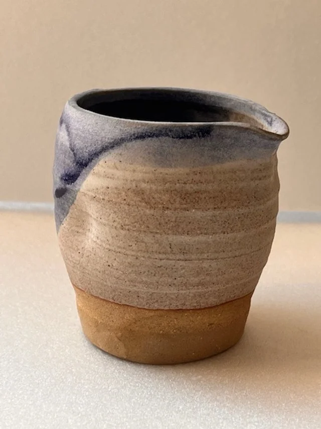 Hand thrown pinched in jug or creamer