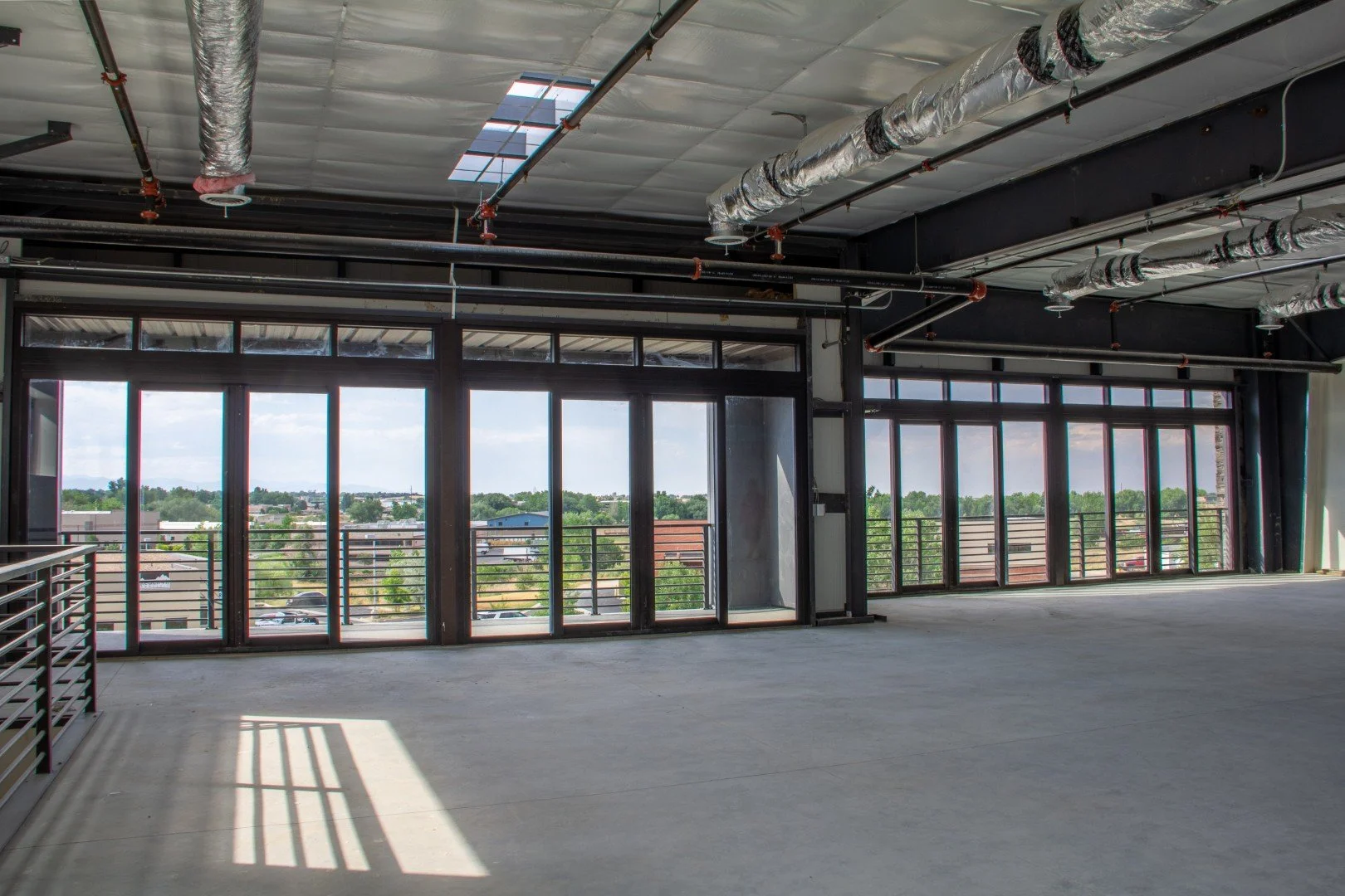 Second-floor office space in Unit 204 at Own It Vista flex office warehouse condos in Lafayette, Colorado.