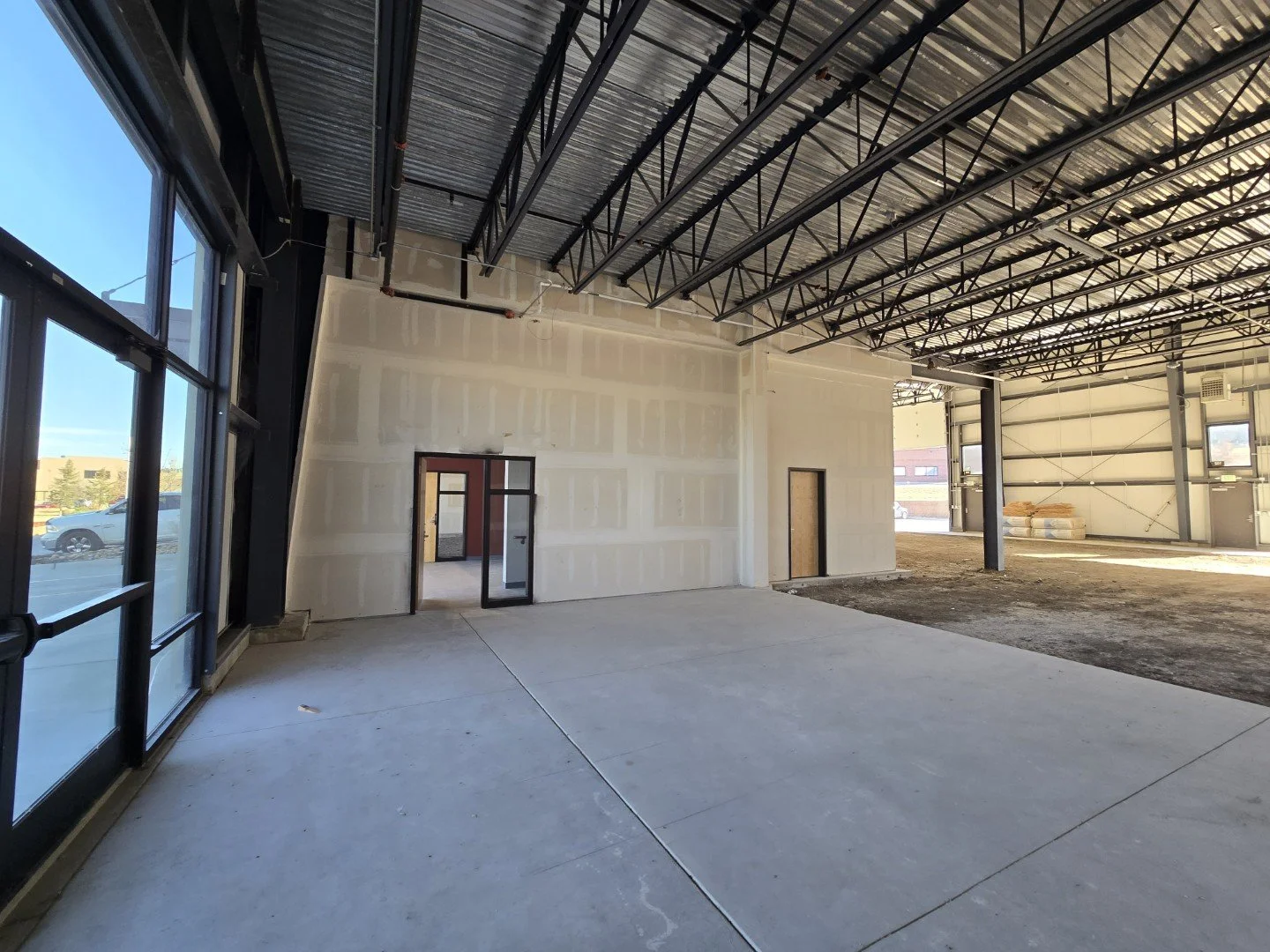 Large open warehouse unit interior at Own It Vista flex industrial condos in Lafayette Colorado showing open floor area and high ceilings.