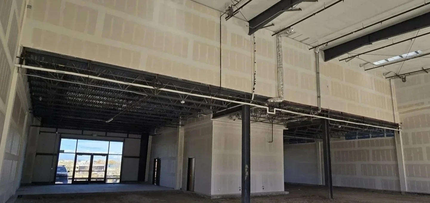 Interior warehouse unit with mezzanine expansion area and high clear height at Own It Vista flex office warehouse condos in Lafayette Colorado.