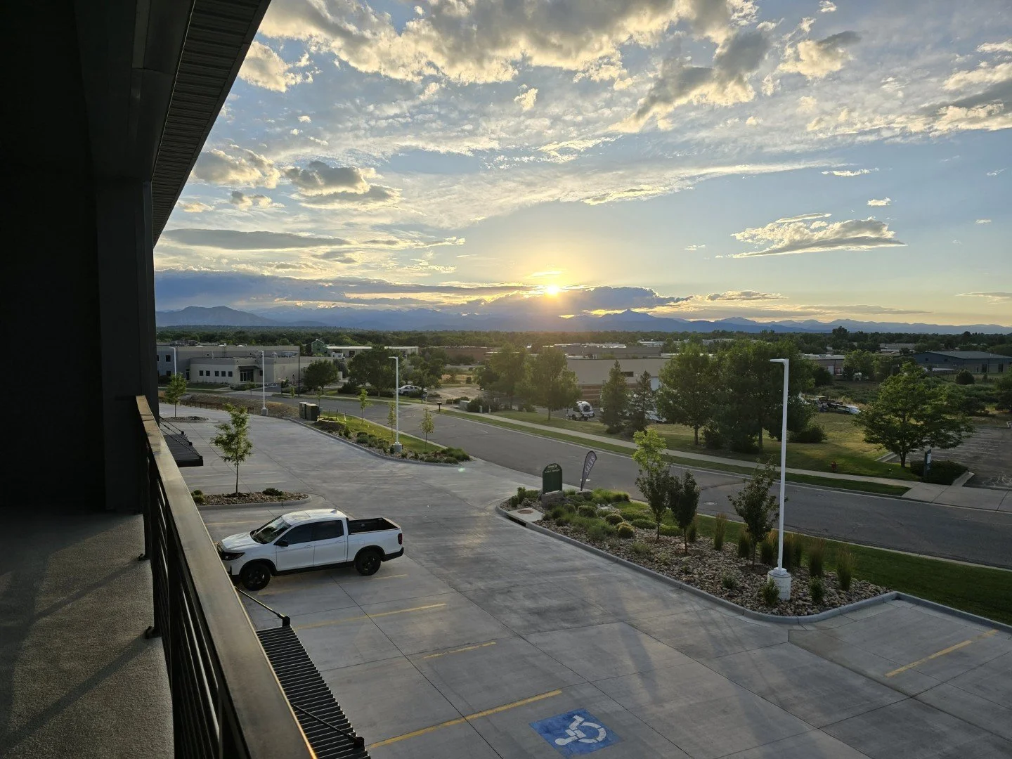 Private open air balcony at Unit 204 of Own It Vista flex office condos in Lafayette Colorado with mountain views.