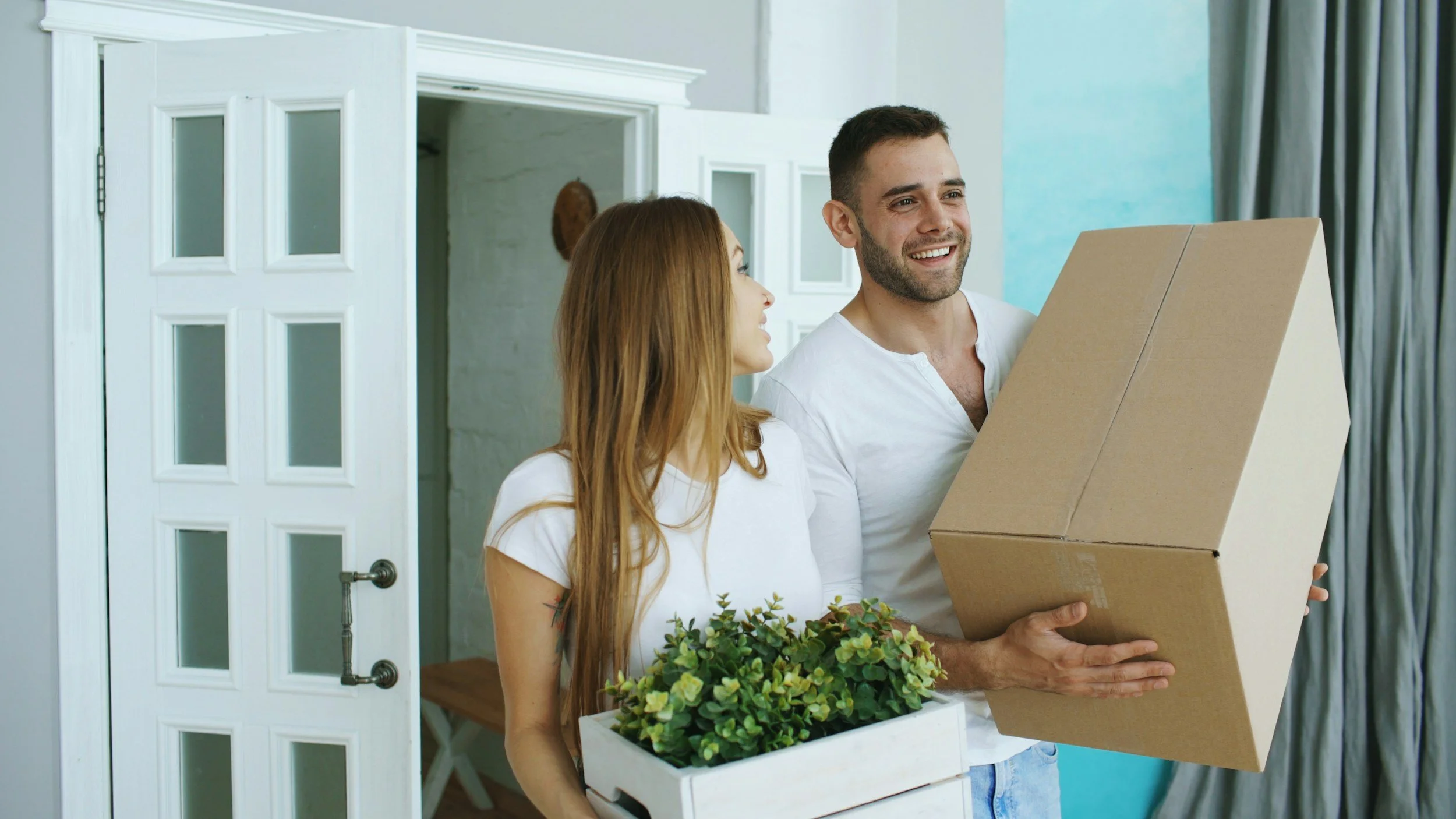 A young couple moving into a new home.
